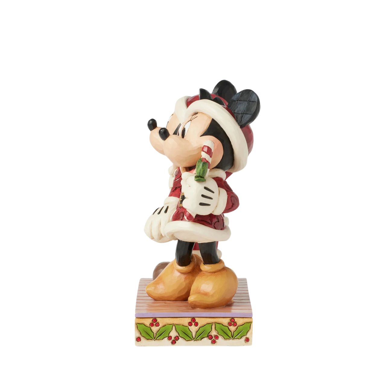 In this festive Jim Shore scene, Mickey and Minnie Mouse don Santa suits adorned with intricate rosemaling patterns and joyfully carry candy canes. Their bright smiles radiate holiday cheer, making the scene a delightful celebration of the season.