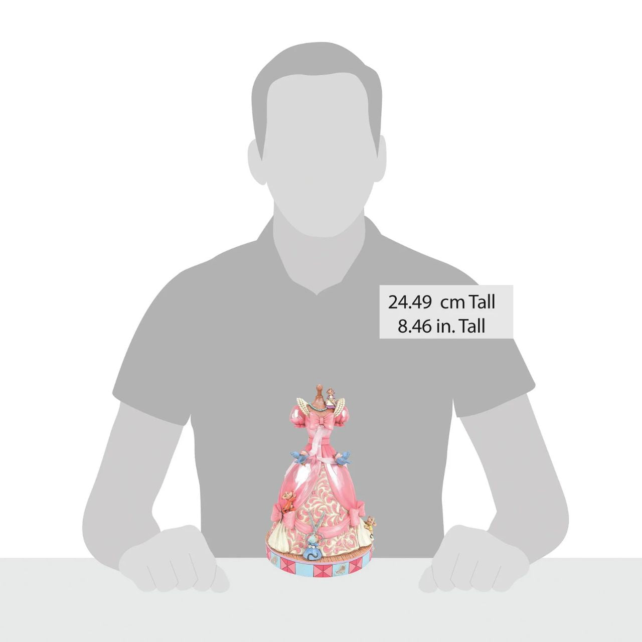 The iconic pink dress from Disney's 1950 masterpiece Cinderella, has been reimagined by artist Jim Shore. With Cinderellas bird and mouse friends, this beautiful dress comes to life. To make this figurine even more special, it plays A Dream is a Wish Your Heart Makes from the film.