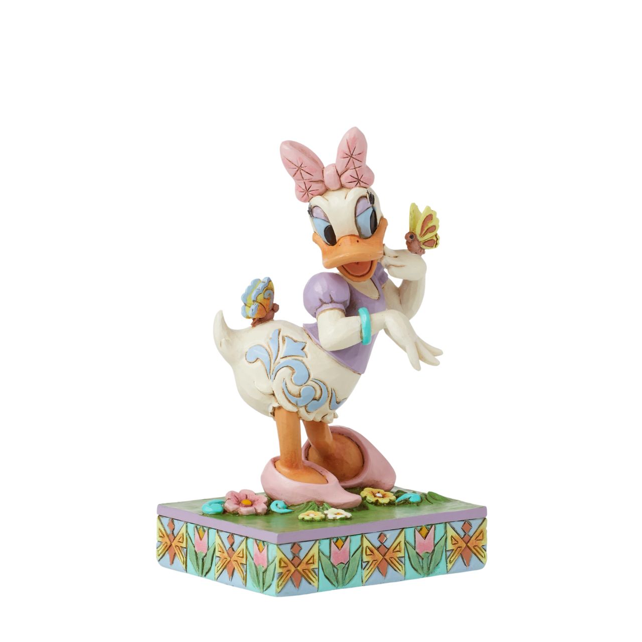 Donald Ducks super cute girlfriend Daisy Duck is here to celebrate the joy of Spring. Hand crafted and painted, she is part of the Disney Traditions collection by Jim Shore. Comes in a fully branded gift box.