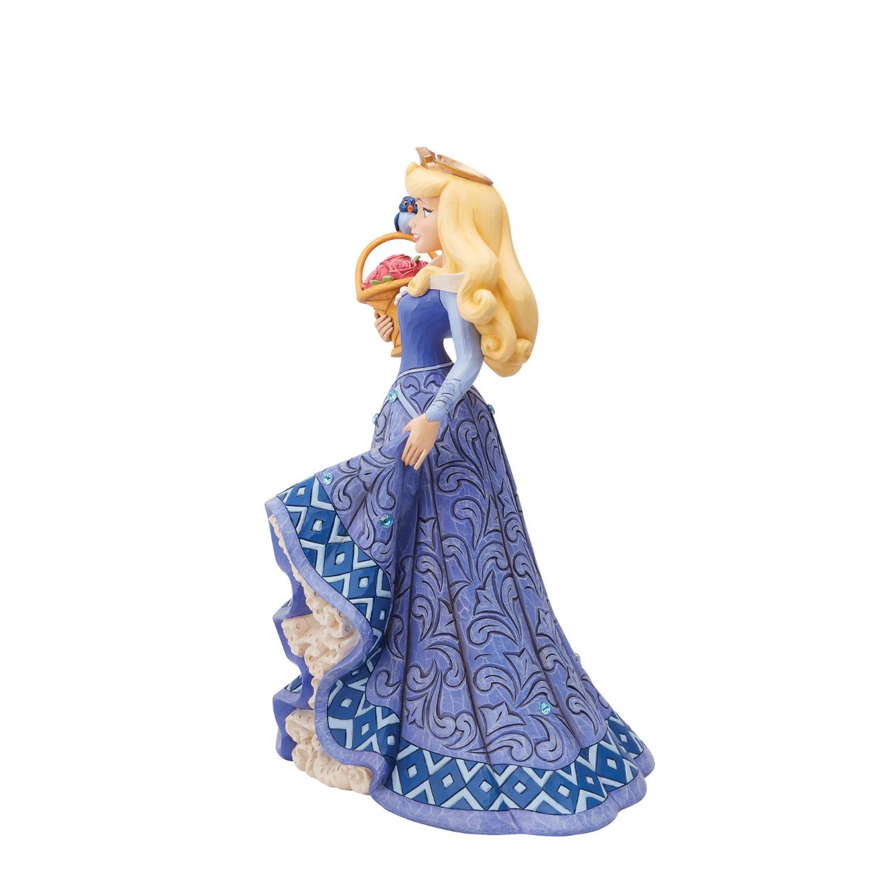Introducing the Deluxe Aurora Figurine from Disney Traditions by Jim Shore. This exquisite piece depicts Sleeping Beauty Aurora in a beautiful, blue dress, accessorized with a stunning crown, carrying a basket of pink roses with a small bluebird perched on top.