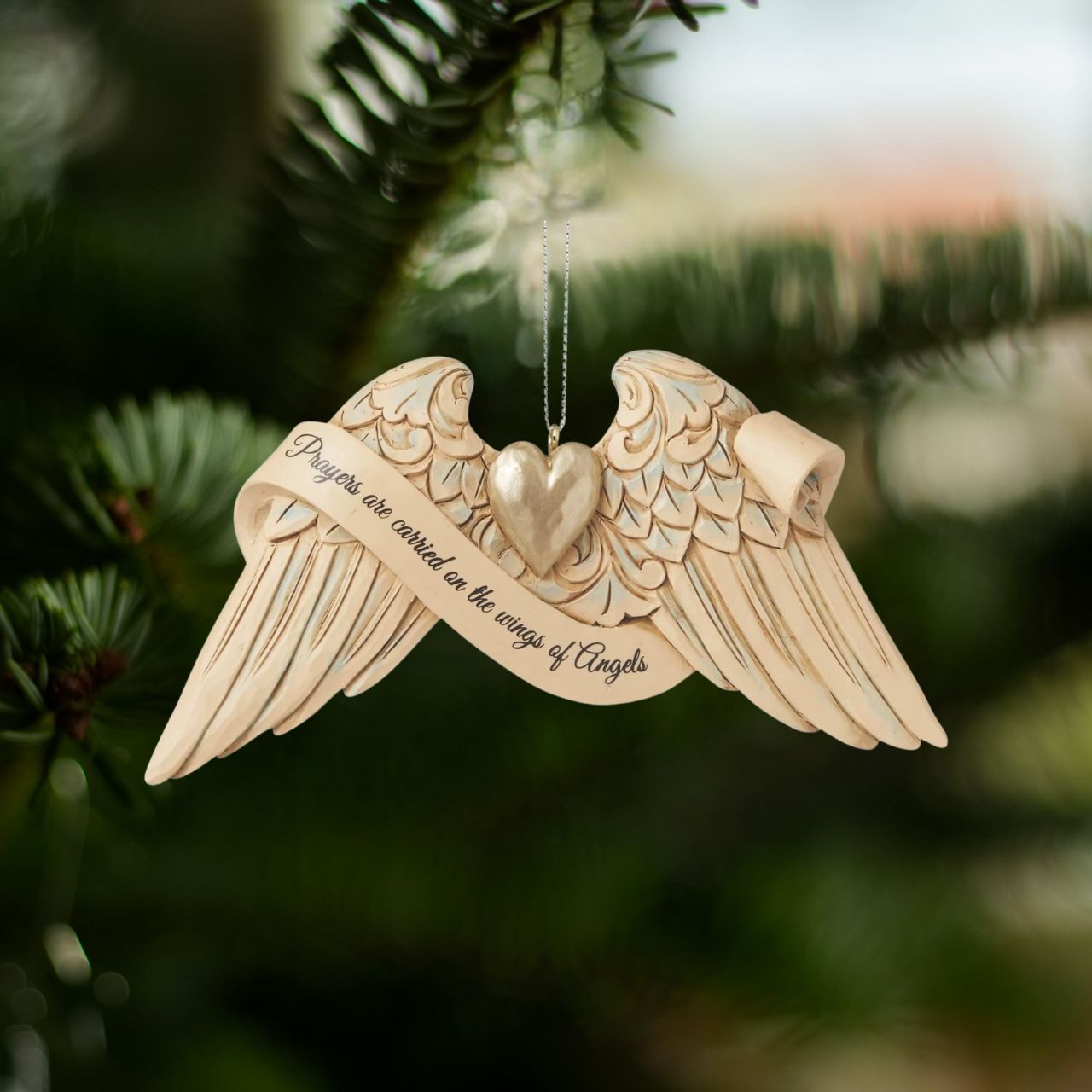 Jim Shore Heartwood Creek General Prayer Angel Wings Hanging Ornament  These delicately sculpted handpainted angel wings share uplifting messages of faith when we need a reminder. Keep these wings close to remember to find comfort. This pair of Jim Shore angel wings shares a heartfelt message about where our prayers go.