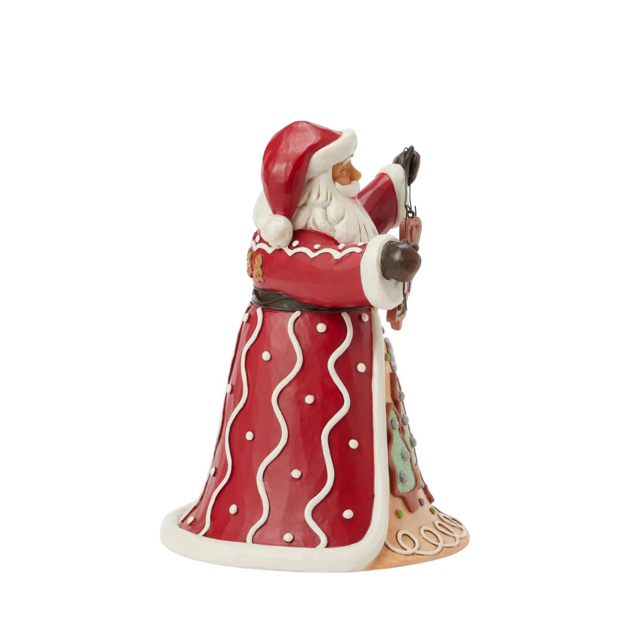 Santa brings the Gingerbread Christmas holiday spirit in this Jim Shore design, holding a string of decorated Christmas cookies. What a joyful smile, Santa presents with his festive garland, while his cloak features a scene of colourful cookies with icing decorations.