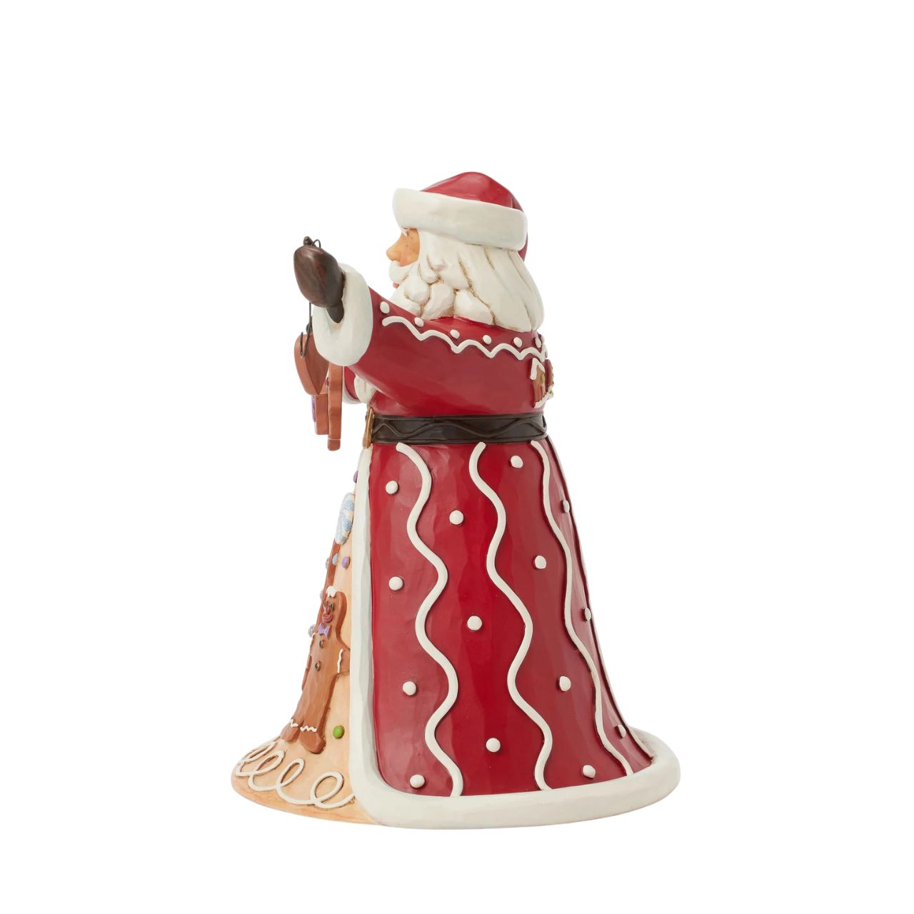 Santa brings the Gingerbread Christmas holiday spirit in this Jim Shore design, holding a string of decorated Christmas cookies. What a joyful smile, Santa presents with his festive garland, while his cloak features a scene of colourful cookies with icing decorations.