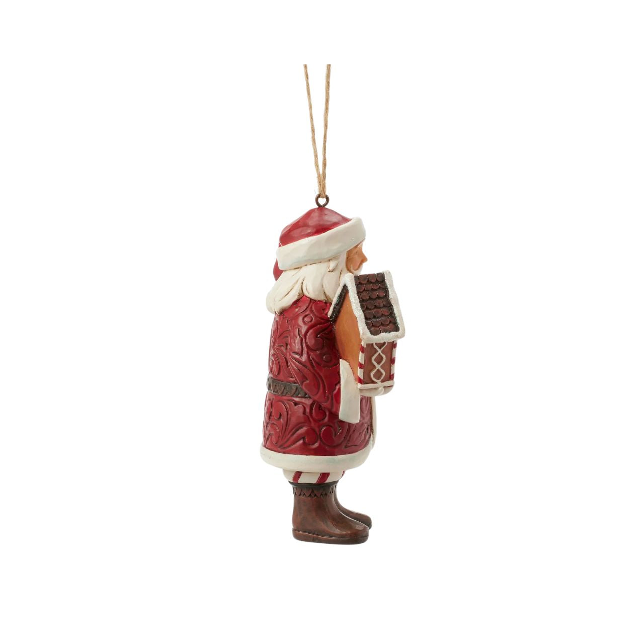 This stunning Gingerbread Christmas Jim Shore ornament features Santa holding a beautifully crafted gingerbread house and a candy cane, all while draped in an ornate rosemaling cloak. With intricate details and vibrant colours, this Santa captures the holiday spirit.