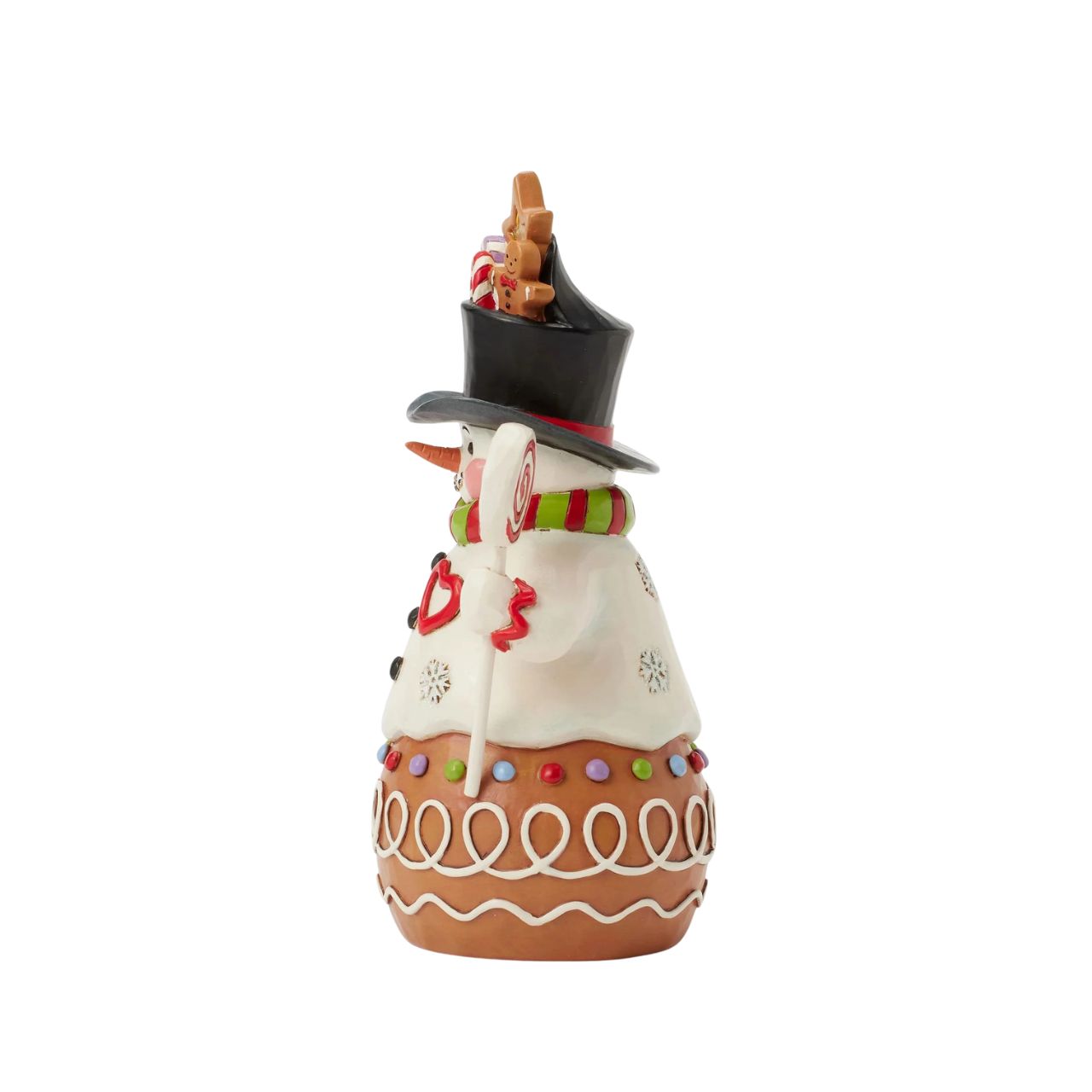 This charming Jim Shore Gingerbread Christmas snowman is too sweet to resist, with icing and candy details decorating his deliciously festive form. Smiling warmly beneath a top hat brimming with sweets, this piece adds a playful touch to your holiday decorations.