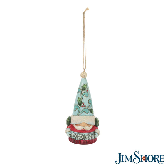 Jim Shore Winter Wonderland Gnome Hanging Christmas Ornament  Winter Wonderland Collection; Bright jewel tones, metallic shimmering and pearlized finishes and coloured glitter accents. This super cute Gnome Hanging Ornament is the perfect addition to any Christmas Tree.