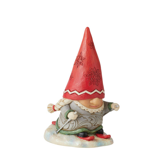 Gnome Skier with Braids Figurine by Jim Shore  "Gnomebody loves Christmas as much as Jim Shore" Gnomes have fast become a collectors favourite for Jim Shore and this collection, new to collection, it won't disappoint. This Snow loving couple are ready for the slopes.