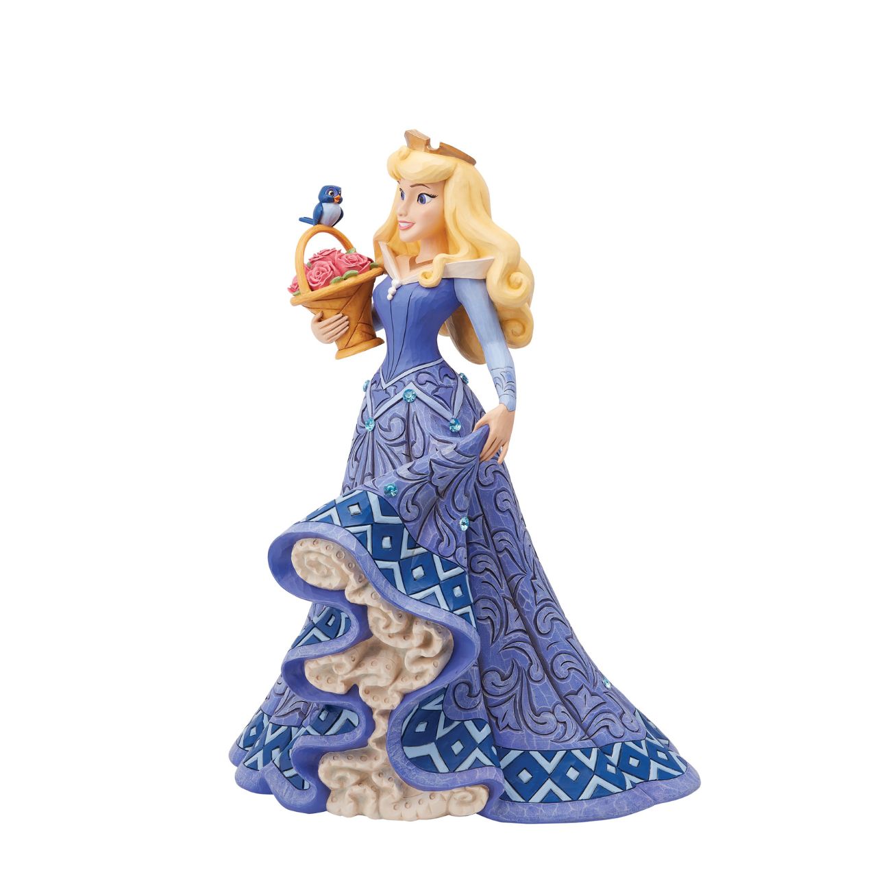 Introducing the Deluxe Aurora Figurine from Disney Traditions by Jim Shore. This exquisite piece depicts Sleeping Beauty Aurora in a beautiful, blue dress, accessorized with a stunning crown, carrying a basket of pink roses with a small bluebird perched on top.