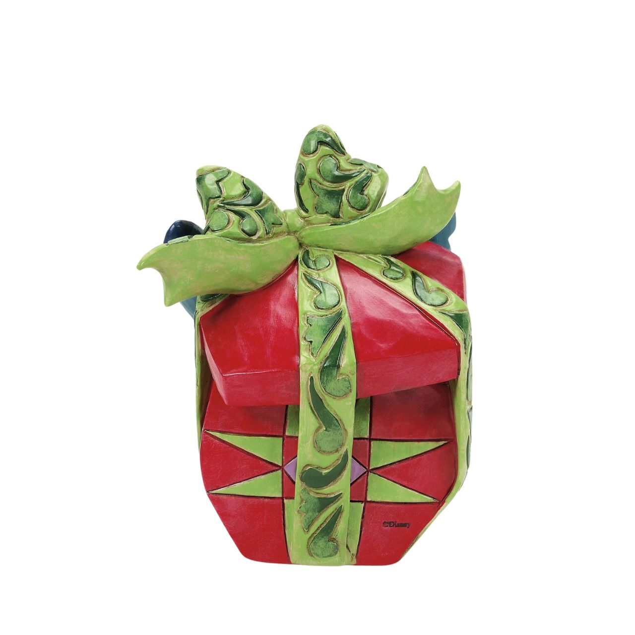 In this playful Jim Shore design, Stitch the alien bursts out of a vibrant Christmas present, showcasing his mischievous grin as he tears through festive wrapping. With his joyful chaos, Stitch proves that his lively presence is the best gift of all.