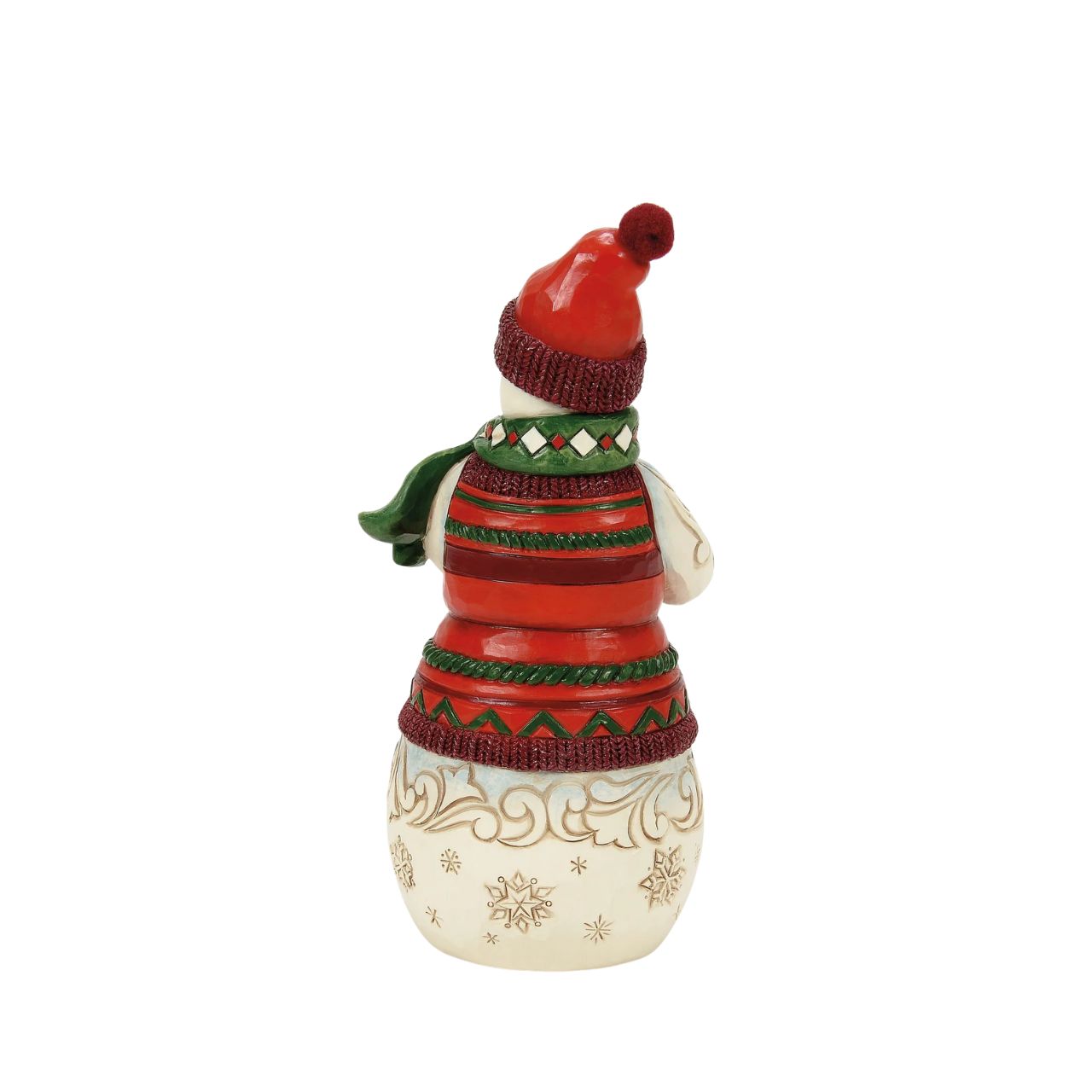 This Christmas at the Lodge Jim Shore snowman is dressed in an intricate red and green tunic and holds a little log cabin. With a knit cap, rosy cheeks, and a joyful smile, he glows with rosemaling and snowflakes, bringing festive warmth and cosy cabin vibes.