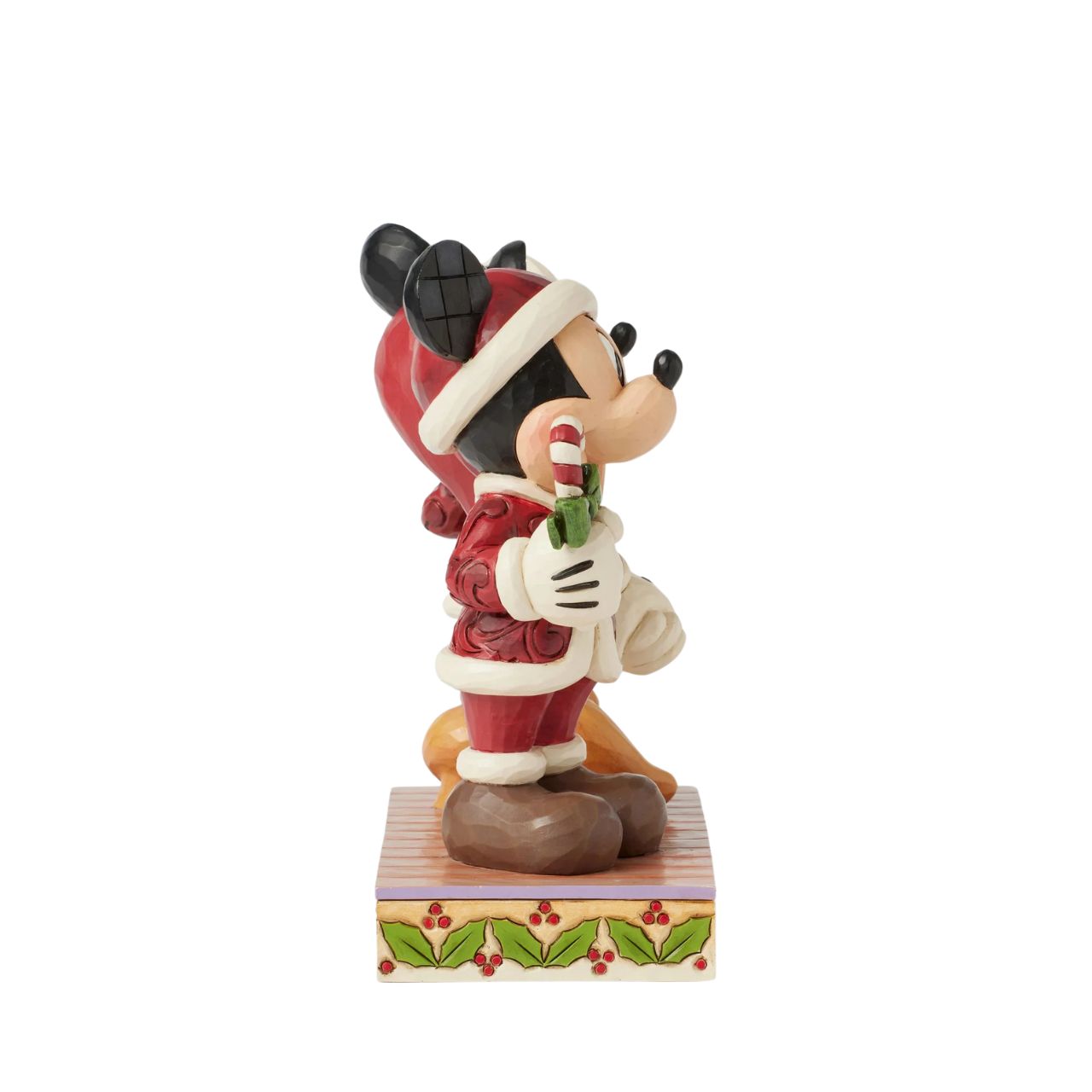 In this festive Jim Shore scene, Mickey and Minnie Mouse don Santa suits adorned with intricate rosemaling patterns and joyfully carry candy canes. Their bright smiles radiate holiday cheer, making the scene a delightful celebration of the season.