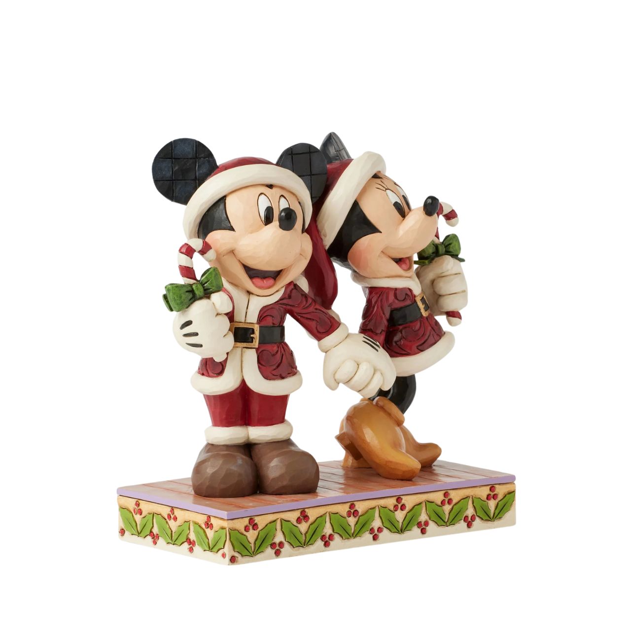 In this festive Jim Shore scene, Mickey and Minnie Mouse don Santa suits adorned with intricate rosemaling patterns and joyfully carry candy canes. Their bright smiles radiate holiday cheer, making the scene a delightful celebration of the season.