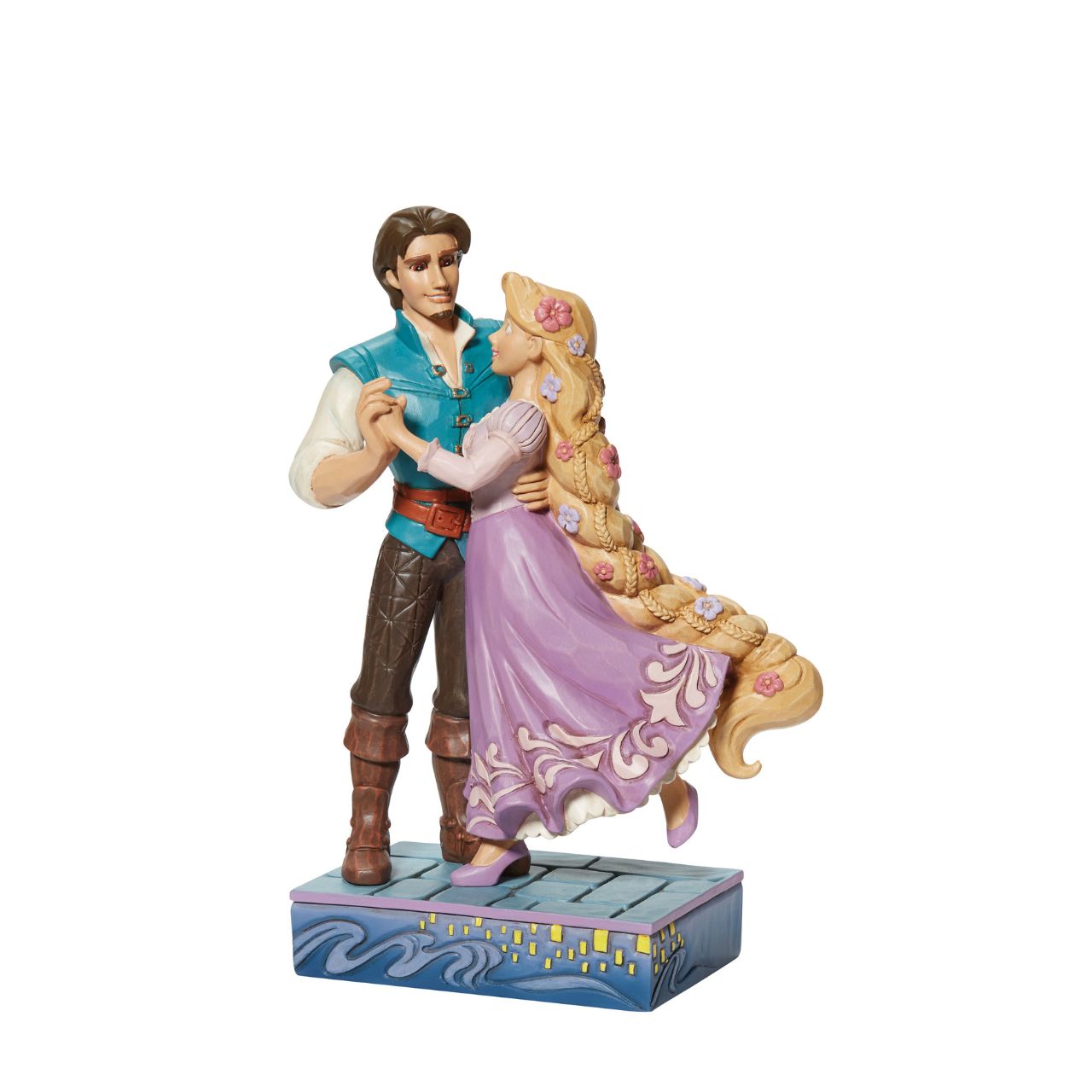 Based on the beloved characters from the 2010 film Tangled, this piece showcases Rapunzel & Flynn Rider happy together. Designed by award winning artist Jim Shore, hand crafted using high quality cast stone and hand painted.