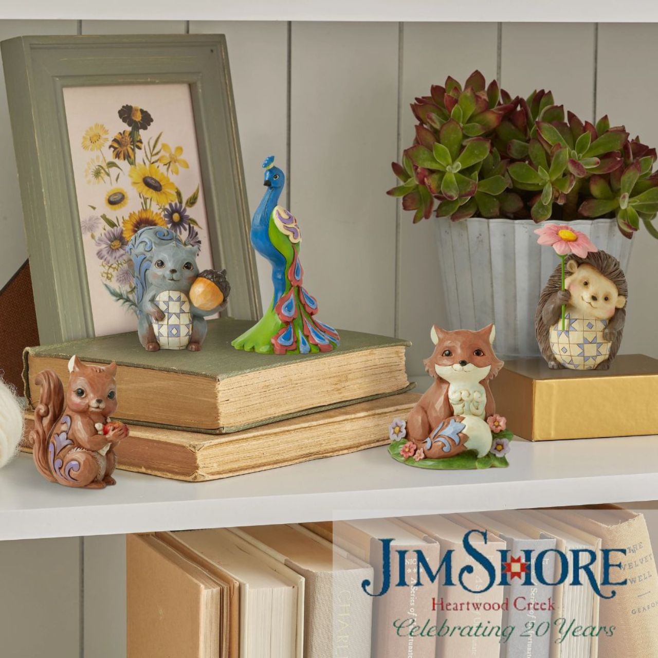 Peacock Mini Figurine by Jim Shore Handcrafted in breath-taking detail, this delightful Peacock Mini Figurine is beautifully decorated in Jim Shore's subtle combination of traditional quilt. These charming friends of the animal kingdom bring a small dose of delight into your home with sweet dispositions and delicate craftsmanship.