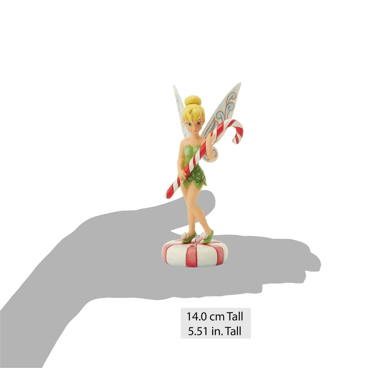 In this enchanting Jim Shore design, Tinker Bell stands atop a vibrant peppermint, delicately holding a candy cane with a sweet smile that radiates holiday warmth. Her enchanting presence brings a touch of pixie dust and magic to the holiday season.
