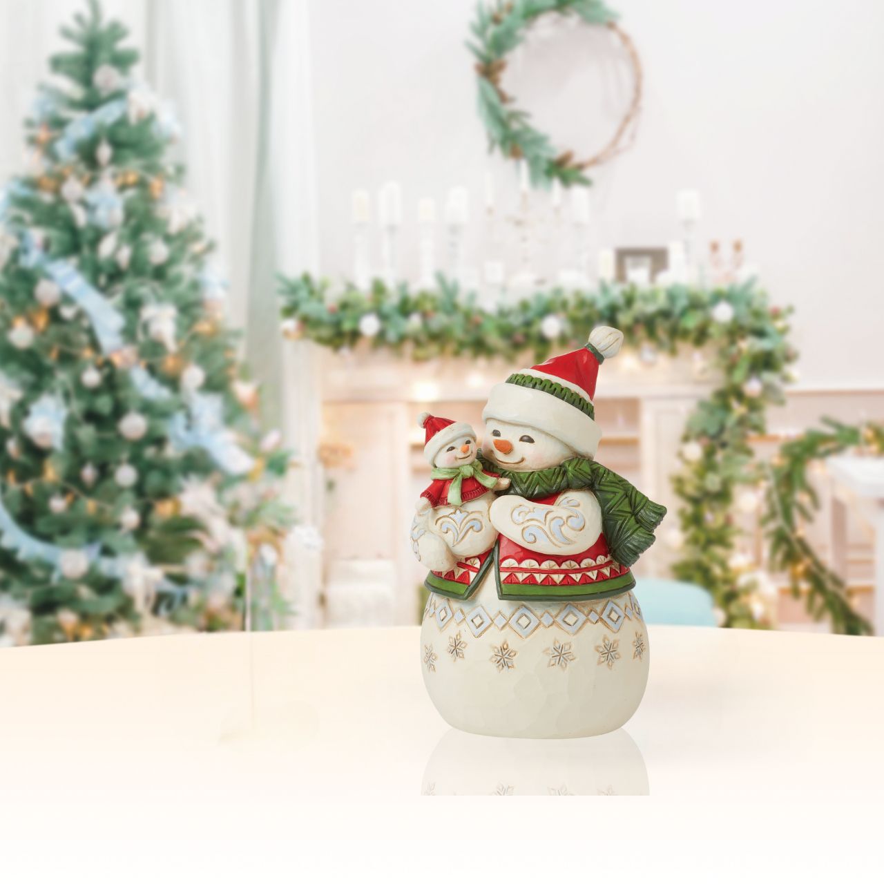 Heartwood Creek  Pint Sized Snowmom With Baby Figurine  Traditional Heartwood Creek Collection; Wood carved textures and intricately detailed designs. This collection of festive pint sized figurines are the perfect addition to a collection, without breaking the bank.