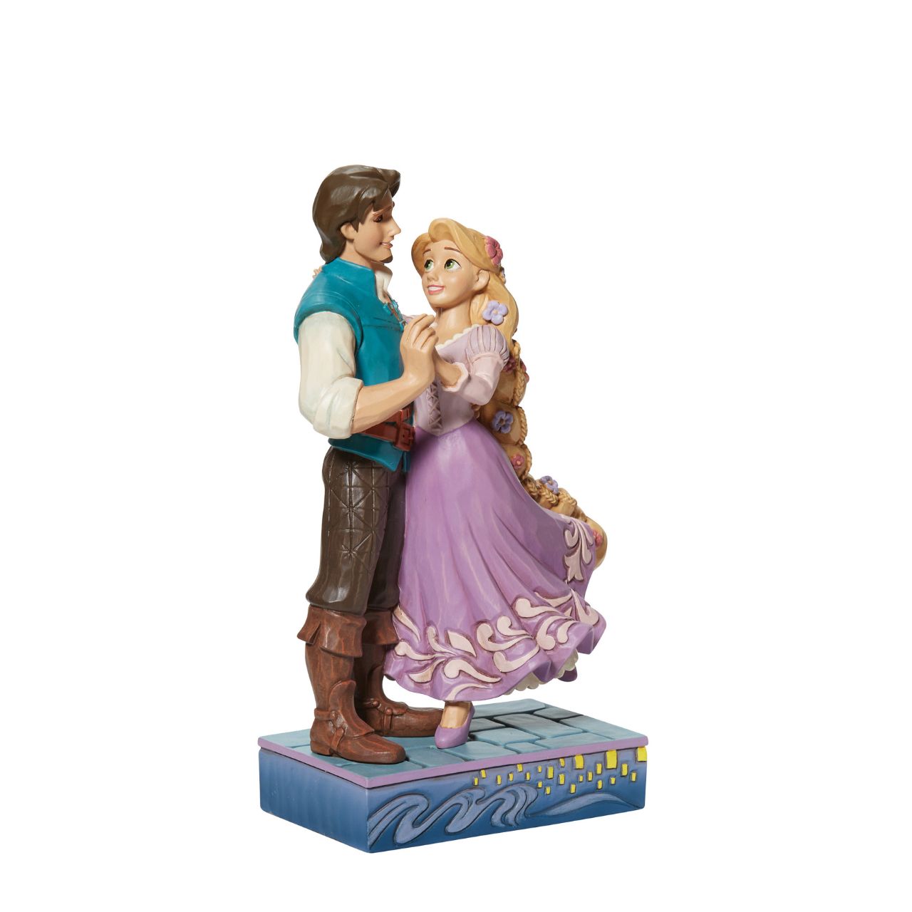 Based on the beloved characters from the 2010 film Tangled, this piece showcases Rapunzel & Flynn Rider happy together. Designed by award winning artist Jim Shore, hand crafted using high quality cast stone and hand painted.