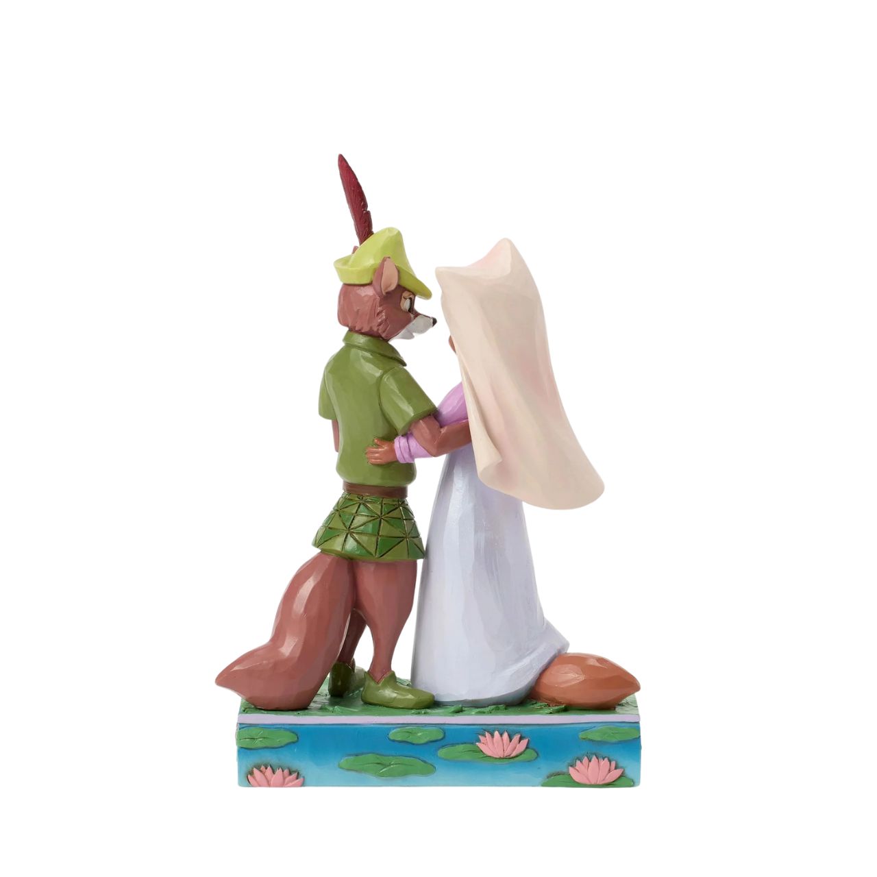 This Jim Shore rendition of Robin Hood and Maid Marian stand hand in hand, gazing into each other's eyes. Adorned with the artist's signature patchwork and rosemaling details, the piece captures the romance and adventure of their timeless story.