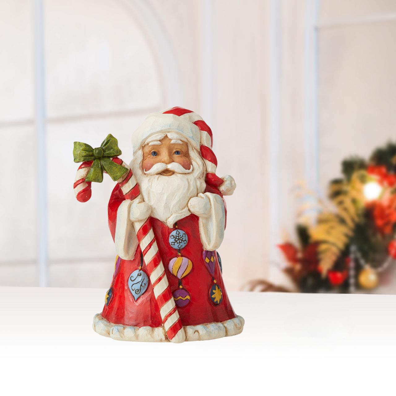 Heartwood Creek Santa with Big Candy Cane Mini Figurine Designed by award-winning artist and sculptor Jim Shore for Heartwood Creek. Item is supplied in branded gift packaging. Unique variations should be expected as product is hand painted.