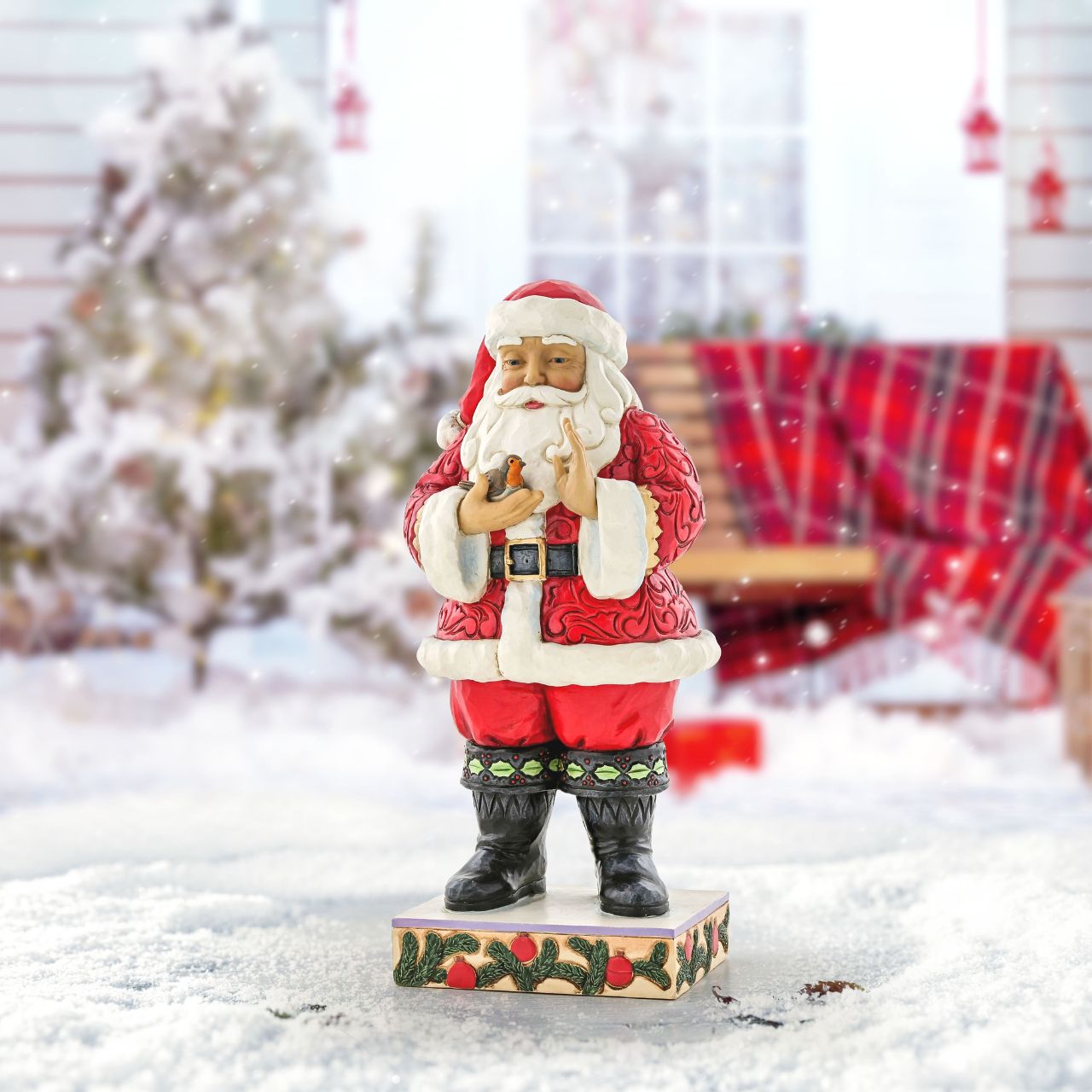 Santa with Robin in Hands Figurine by Jim Shore Wearing holly brimmed boots and rosemaled suit, this Santa statuette delicately holds a Robin in his hands. Widely revered, Robins are thought to represent loved ones lost. Celebrate the Christmas in remembrance and love with Jim Shore. Exclusively available in UK and Europe.