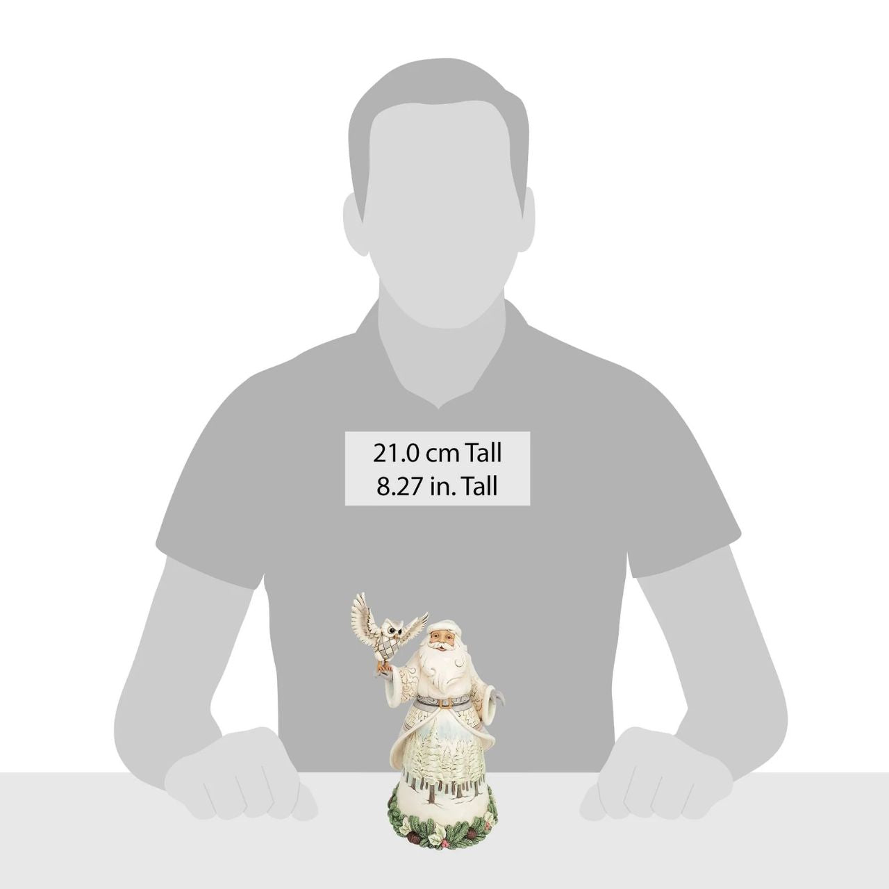 This stunning Jim Shore design features Santa adorned in a gorgeous white cloak trimmed with lush garland, reaching out to a majestic owl.