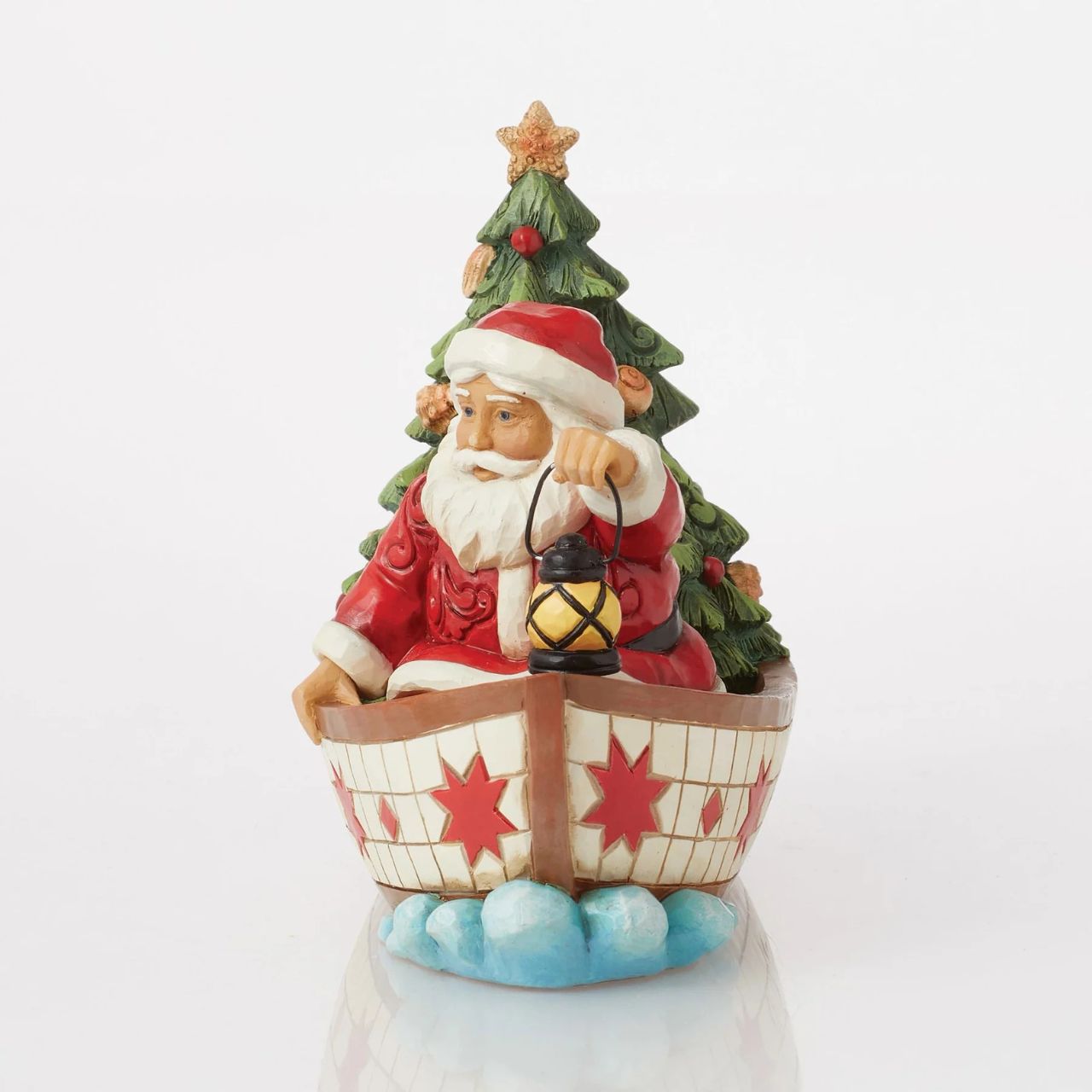 Santa Claus delivers to everywhere in the world. Sometimes he uses other means of transportation than his reindeer sleigh. For coastal deliveries, Santa utilizes a gorgeous red and white boat complete with shell adorned tree and guiding lantern.