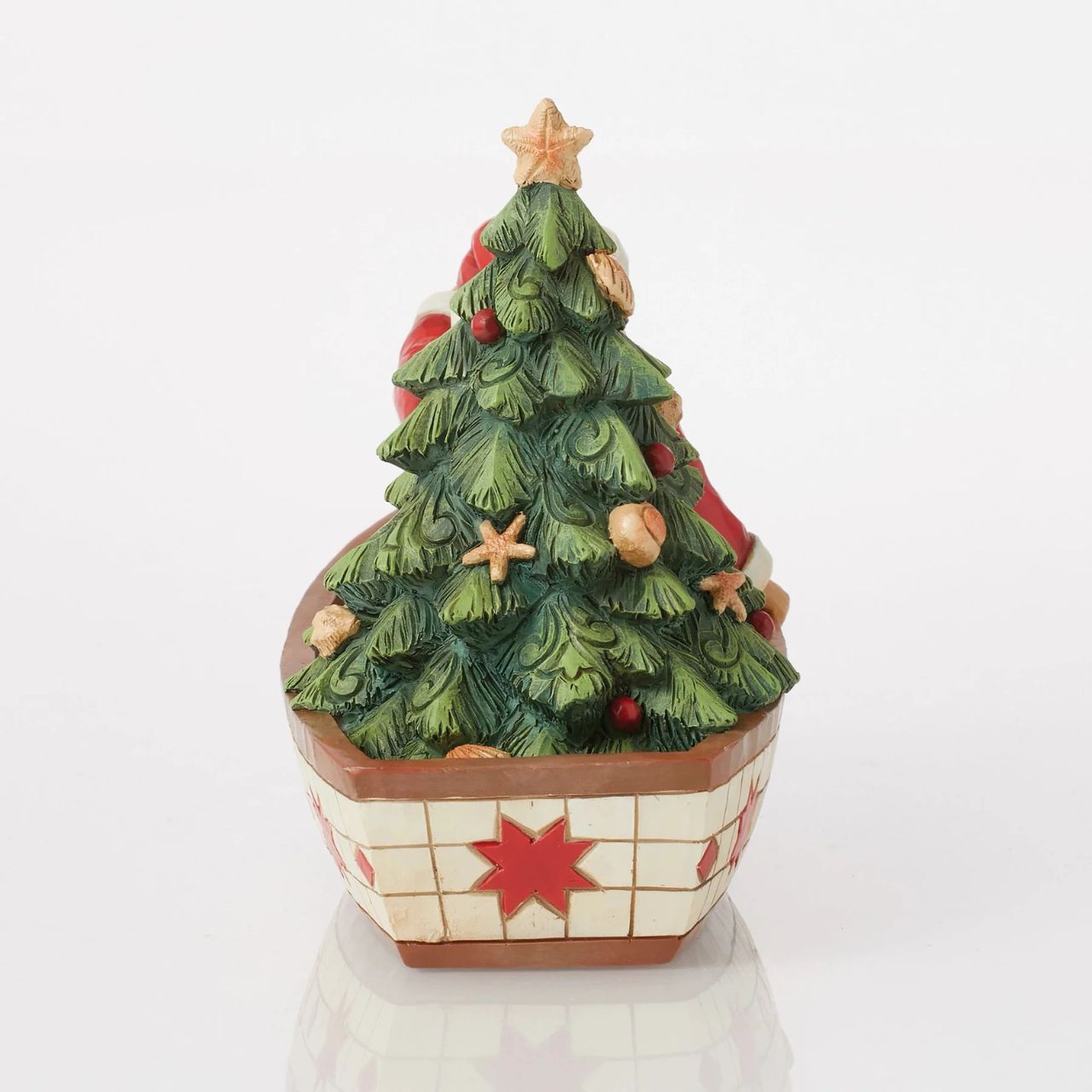 Santa Claus delivers to everywhere in the world. Sometimes he uses other means of transportation than his reindeer sleigh. For coastal deliveries, Santa utilizes a gorgeous red and white boat complete with shell adorned tree and guiding lantern.