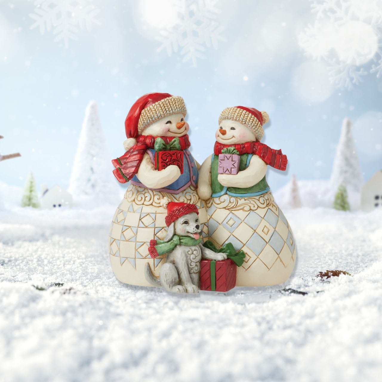 Heartwood Creek Christmas Collection Snowman Couple with Puppy Figurine Designed by award winning artist Jim Shore as part of the Heartwood Creek Christmas Collection, hand crafted using high quality cast stone and hand painted, this Snowman couple with their cute puppy is perfect for the Christmas season.