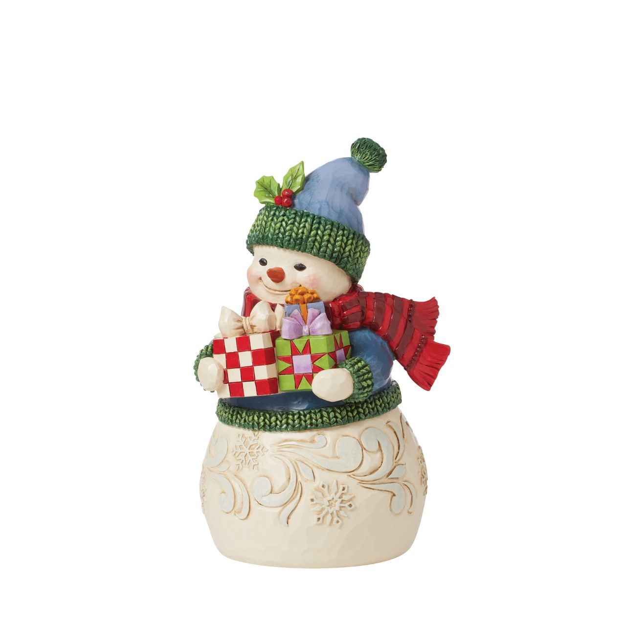 This charming snowman figurine by Jim Shore inspires holiday happiness. Keeping warm wearing a knitted sweater, holly trim hat, and billowing red scarf this snowman boasts rosy cheeks in the chilled air. He smiles with arms full.