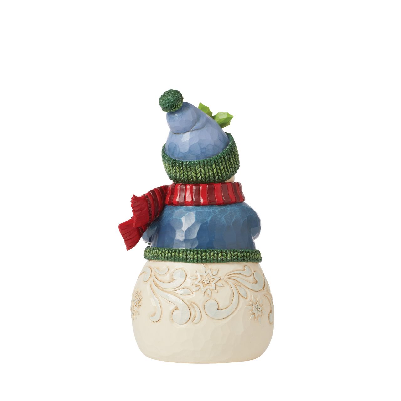 This charming snowman figurine by Jim Shore inspires holiday happiness. Keeping warm wearing a knitted sweater, holly trim hat, and billowing red scarf this snowman boasts rosy cheeks in the chilled air. He smiles with arms full.