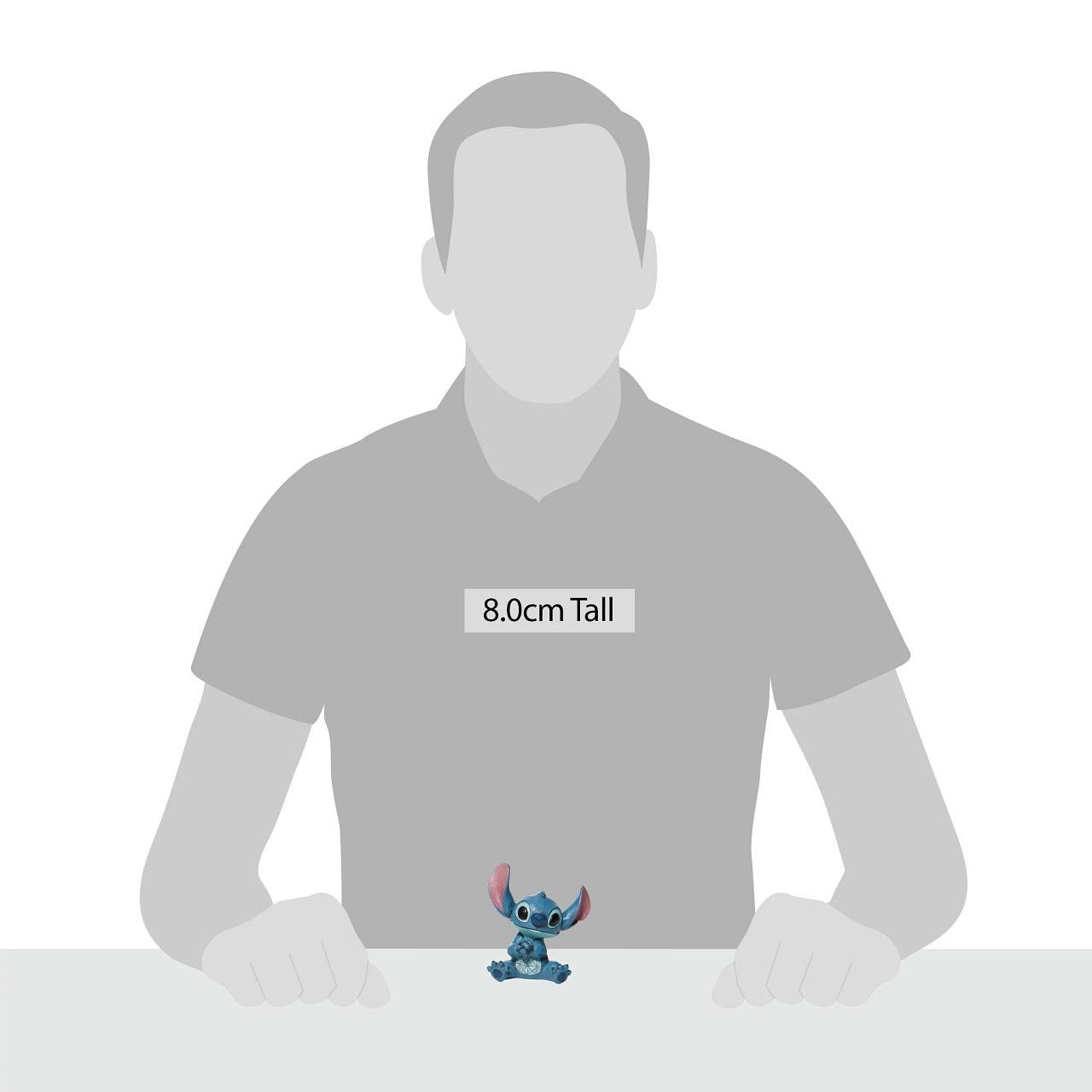 Jim Shore Stitch Mini Figurine Everyone's favourite alien, Stitch, looks extra adorable in this mini figurine by Jim Shore. Hands clasped, the temperamental alien appears soothed in this figurine, one can only imagine he's listening to Elvis records or watching Lilo hula.