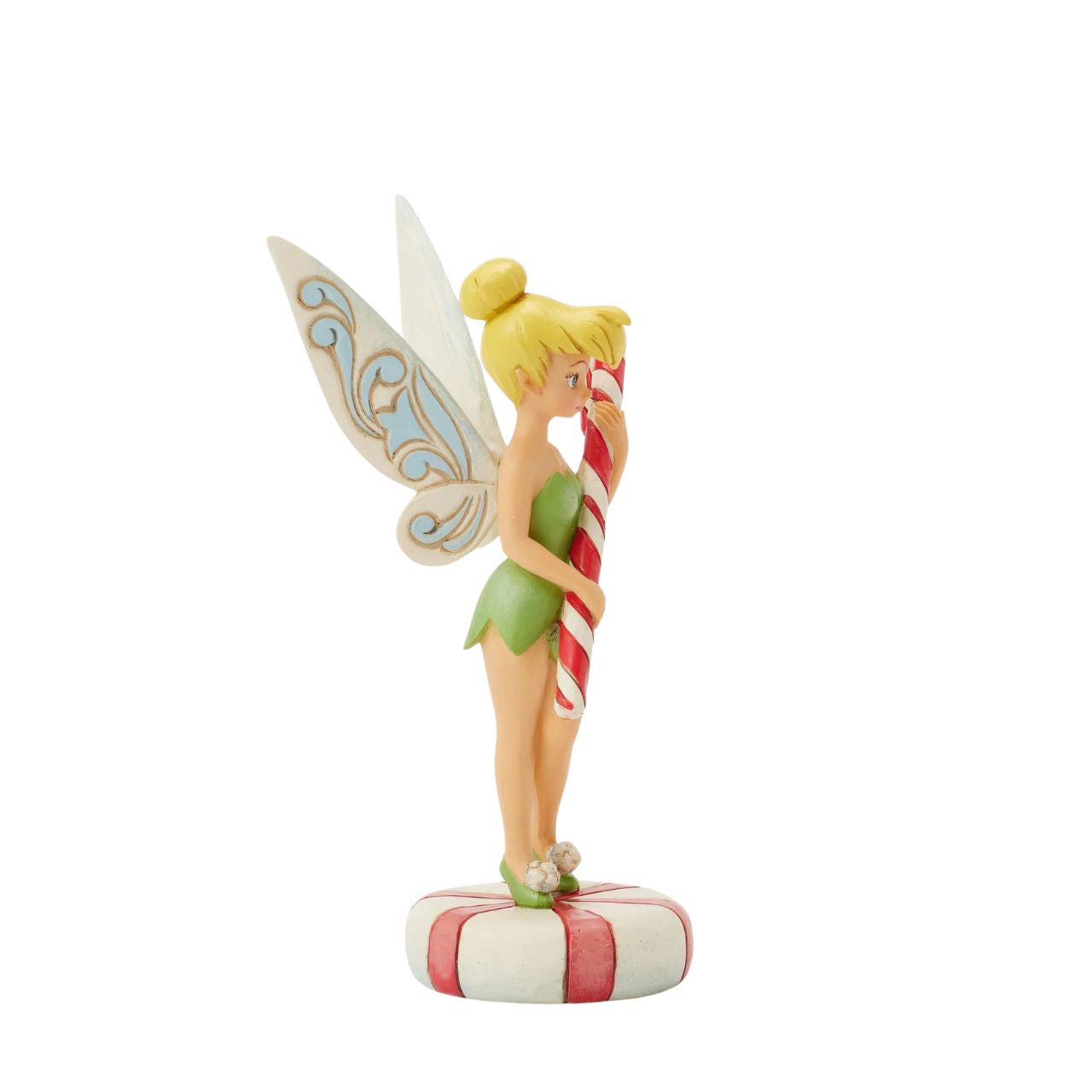 In this enchanting Jim Shore design, Tinker Bell stands atop a vibrant peppermint, delicately holding a candy cane with a sweet smile that radiates holiday warmth. Her enchanting presence brings a touch of pixie dust and magic to the holiday season.