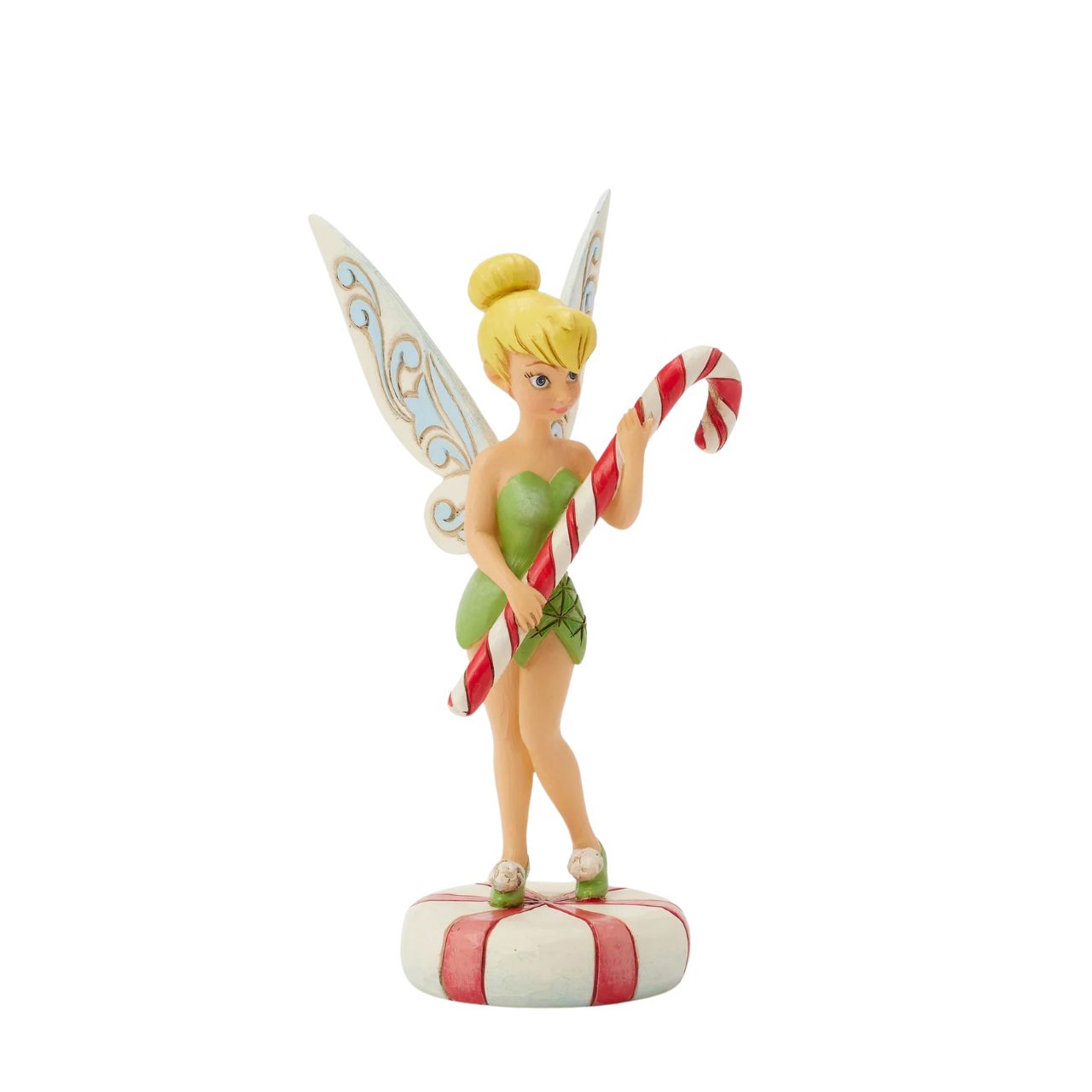 In this enchanting Jim Shore design, Tinker Bell stands atop a vibrant peppermint, delicately holding a candy cane with a sweet smile that radiates holiday warmth. Her enchanting presence brings a touch of pixie dust and magic to the holiday season.