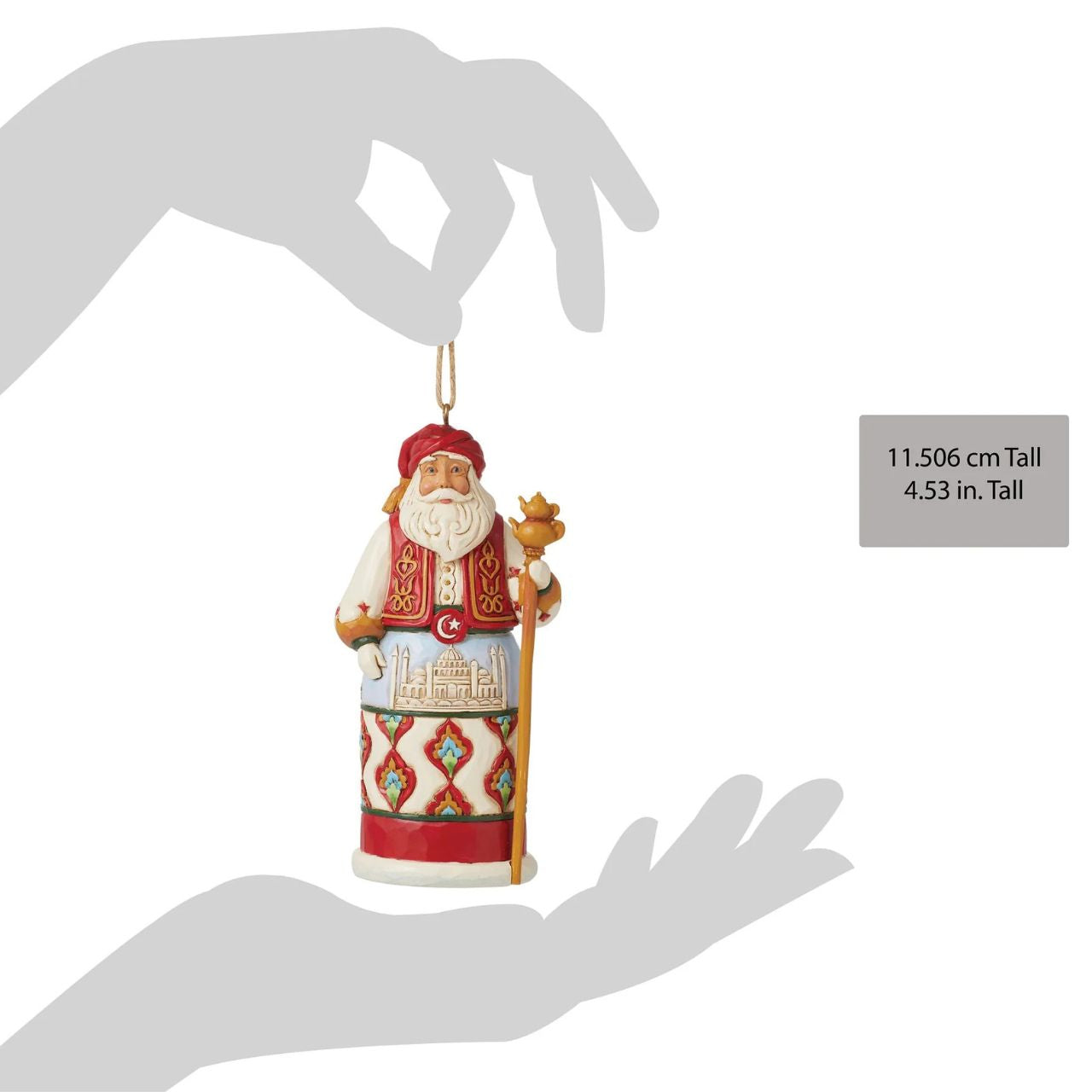 Jim Shore's Christmas Around the World collection celebrates tradition and culture. Incorporating each country's unique customs, this Turkish Santa ornament wears traditional robes with famous architecture, a red turban, and ornate designs.