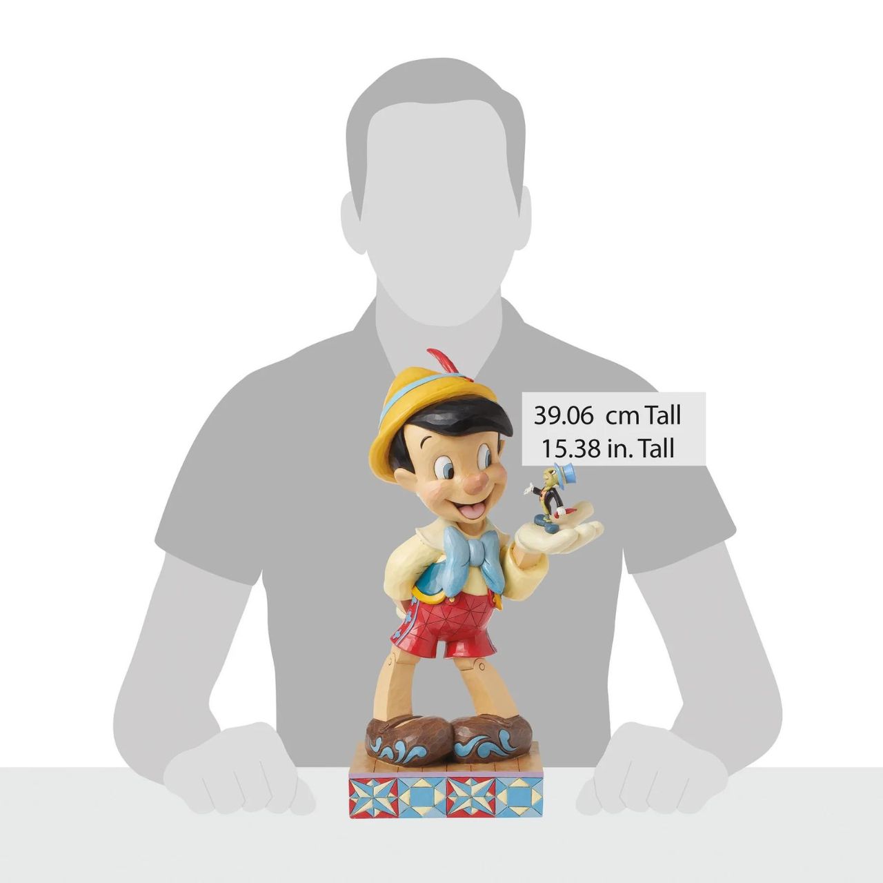 Disney's Pinocchio is the size of a real boy with this figurine. Hand carved and painted, this piece comes from the Disney Traditions collection by Jim Shore. This impressive piece comes packaged in a fully branded gift box.