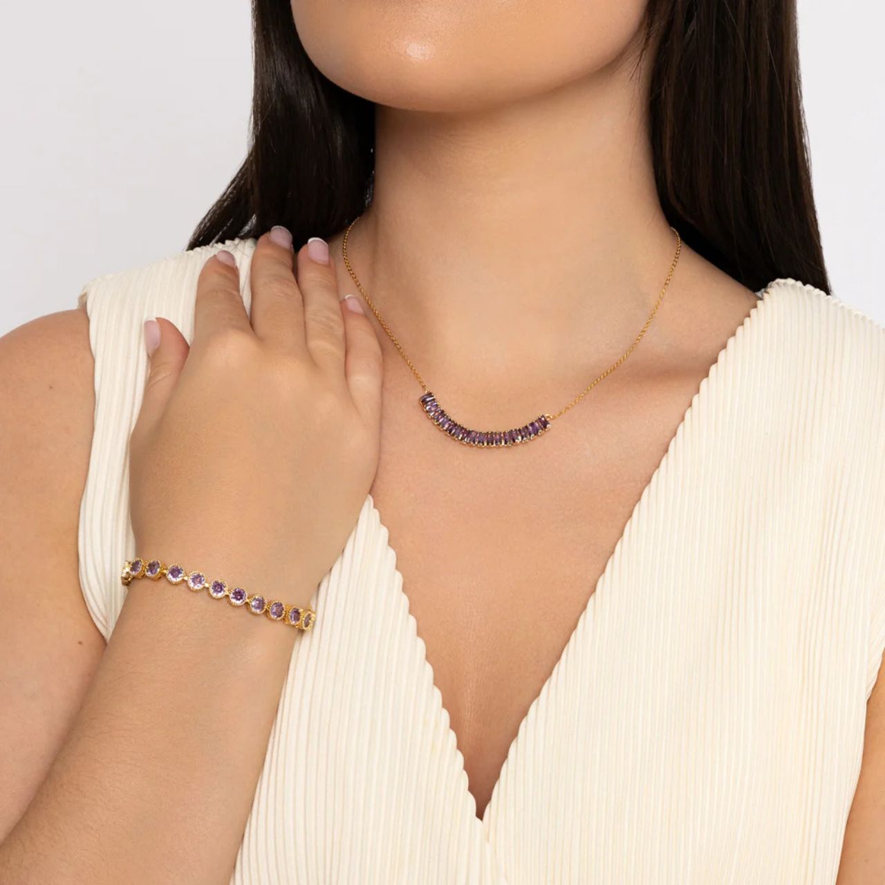 Beautiful necklace of amethyst CZ stones with gold plated chain.