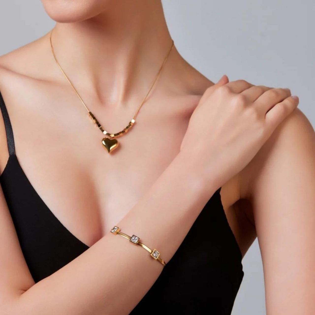 Yellow Gold Emmeline Heart Necklace by Knight & Day Elegant necklace with moveable beads & heart charm. Gold plating.