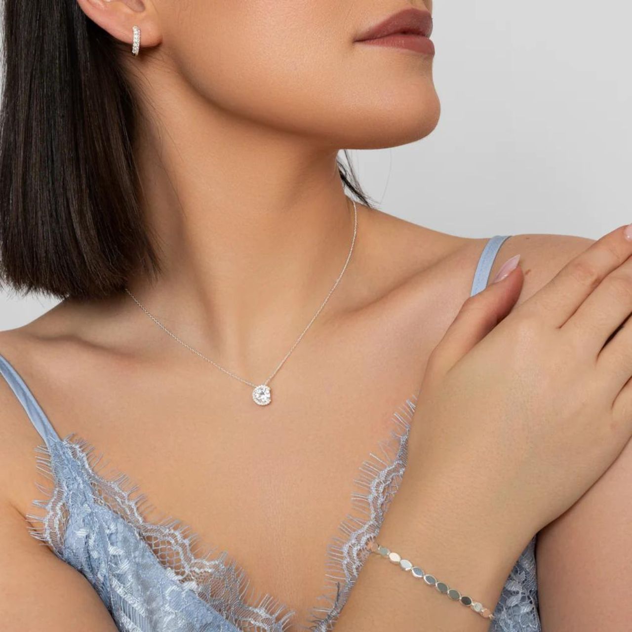 Experience elegance with Knight & Day Silver Huggie Earrings. Made with high-quality silver, these huggies provide a comfortable and secure fit. Perfect for any occasion, add a touch of sophistication to your look with Knight & Day.