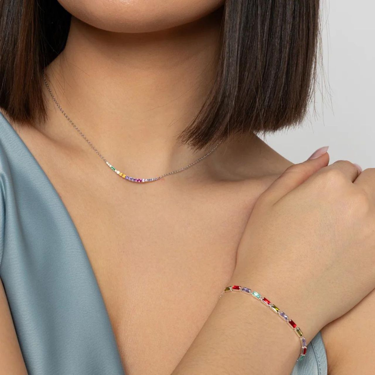 Expertly crafted by Knight & Day, the Silver Rainbow Bracelet is an elegant accessory that will add a touch of sophistication to any outfit. Silver plated, this bracelet is both durable and stylish. Perfect for any occasion, it's a must-have for your jewellery collection.