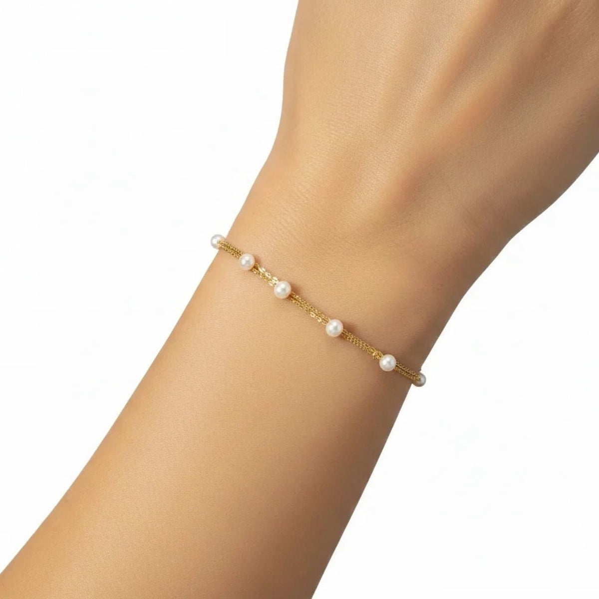 The Natalie Bracelet features a beautiful double-layer design, combining timeless faux pearls with a refined gold finish. Crafted with 18 carat gold plating and 6mm crystal-white glass pearls, it adds a subtle touch of sophistication to any look.