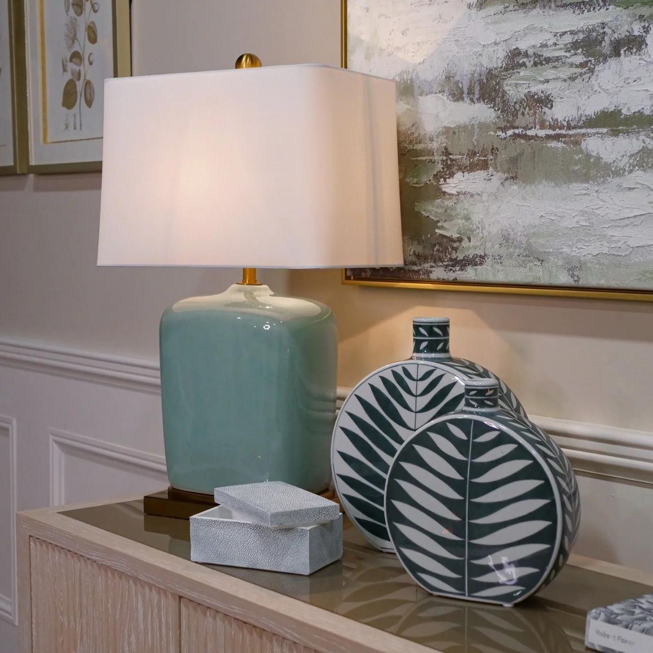Leaf Bottle Small by Mindy Brownes This gorgeous ceramic decorative bottle will add a delicate pop of colour to your home. The calming colour pallet with it's green base and white leaf pattern will make this the perfect spring home accessory.