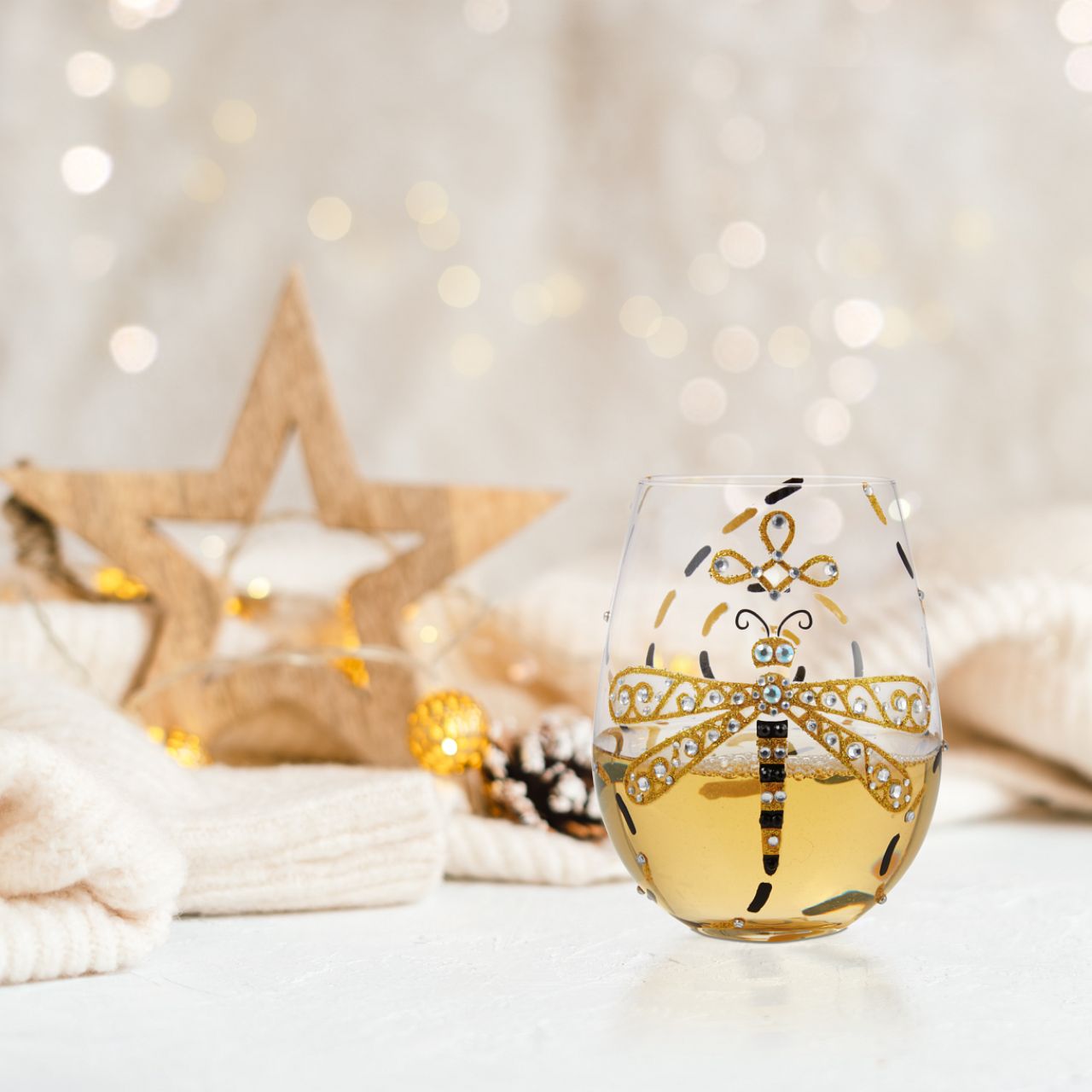 This gorgeous stemless wine glass from Lolita features a hand-painted dragonfly in black and gold. With inlaid crystal patterning, the stylish creature inspires elegance and calm. A symbol sparkles from the bottom of the glass and demands a refill.