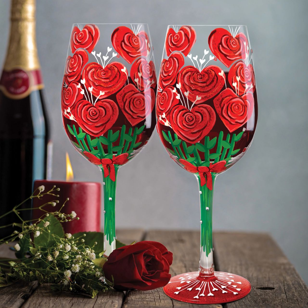 Elevate a romantic evening with this unique wine glass from Lolita showcasing a stunning bouquet of hand-painted red roses crafted into the shape of hearts.