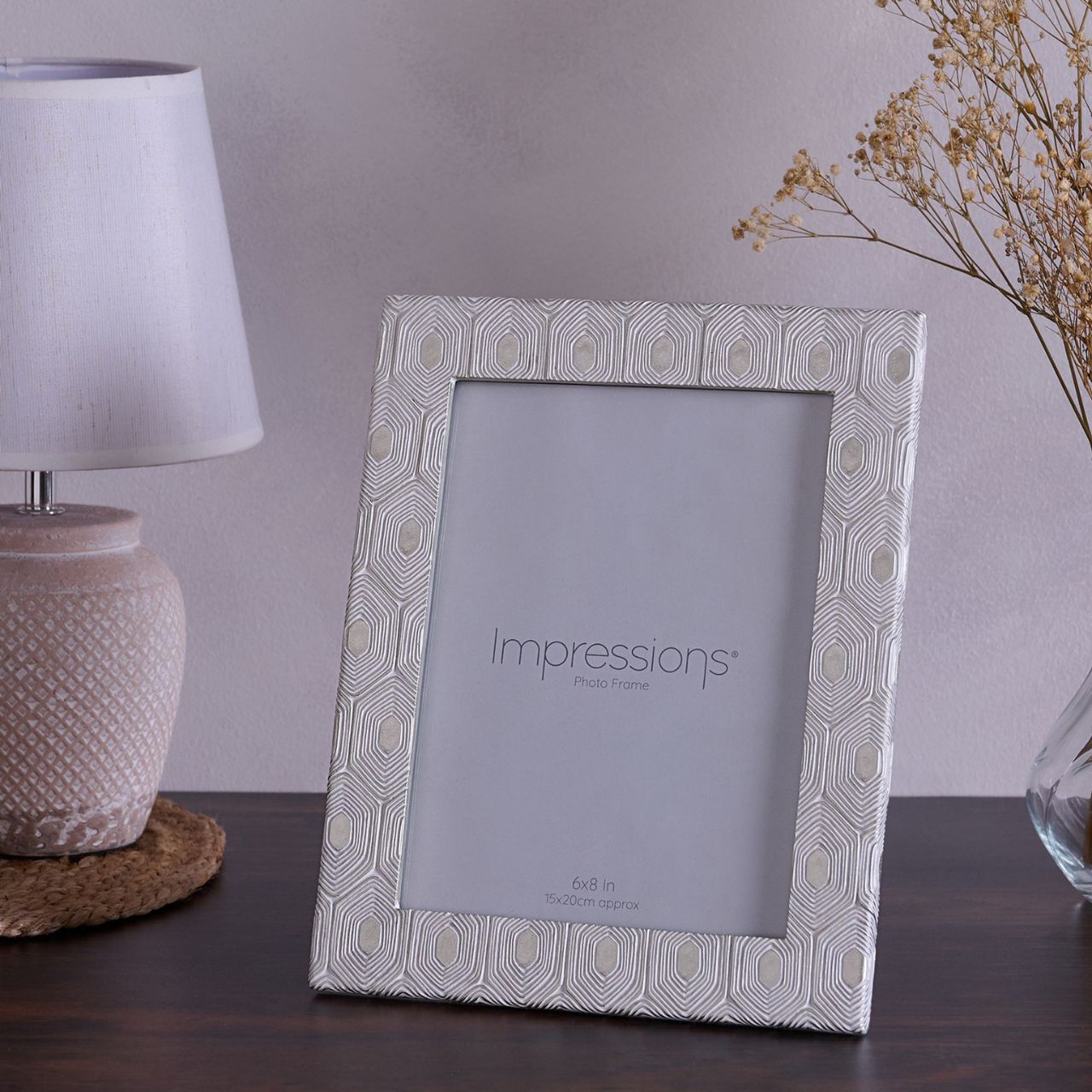 This attractive frame will enhance both the photographs within it and the room it sits within.