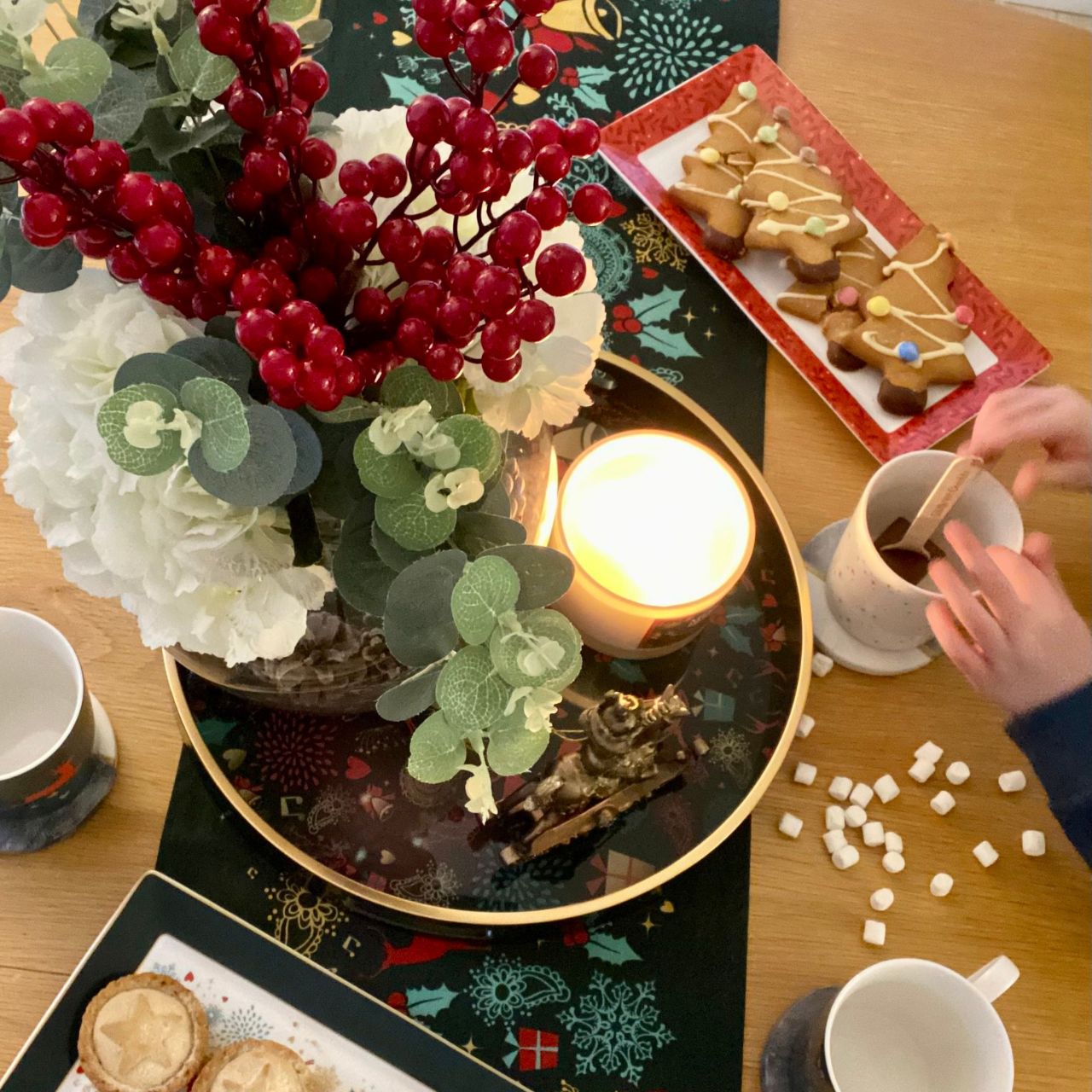 A Christmas Wish Tray by Mindy Brownes Interiors A stunning circular tray, with a rich green surround, gold rim, and a Christmas design that features some of Christmas' key elements, such as reindeer, presents, music notes and more. An ideal styling accessory this Christmas season.