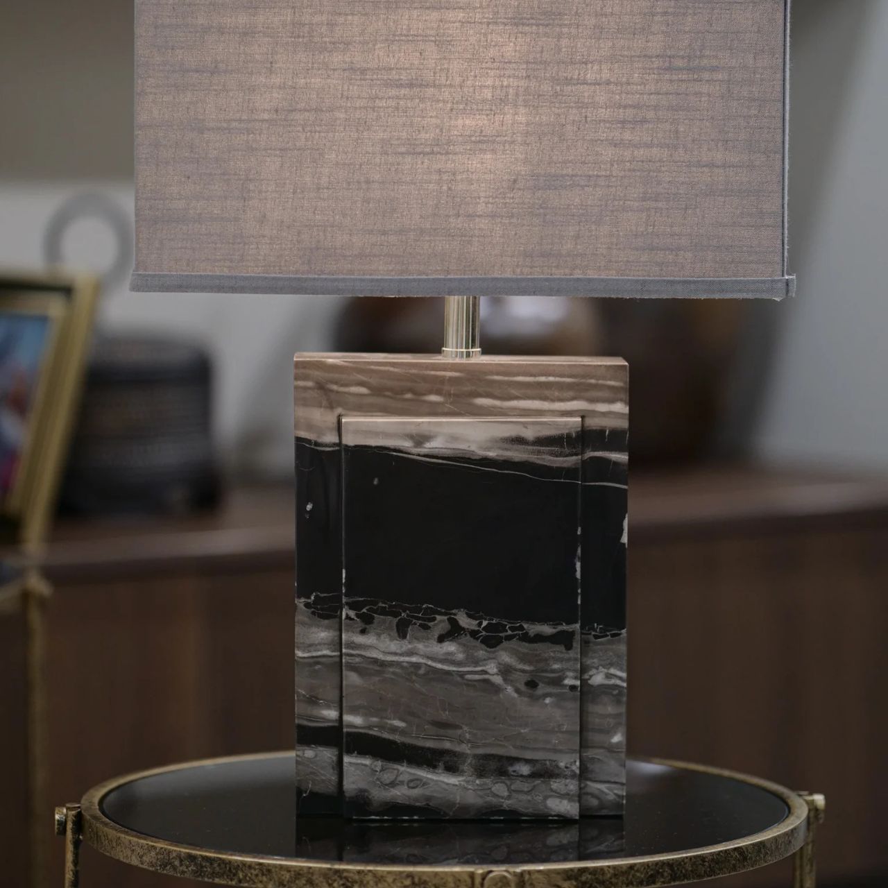 Marble-finished base and charcoal shade. Chrome Accents. Sleek & Contemporary in design. Ideal for any room in the home.