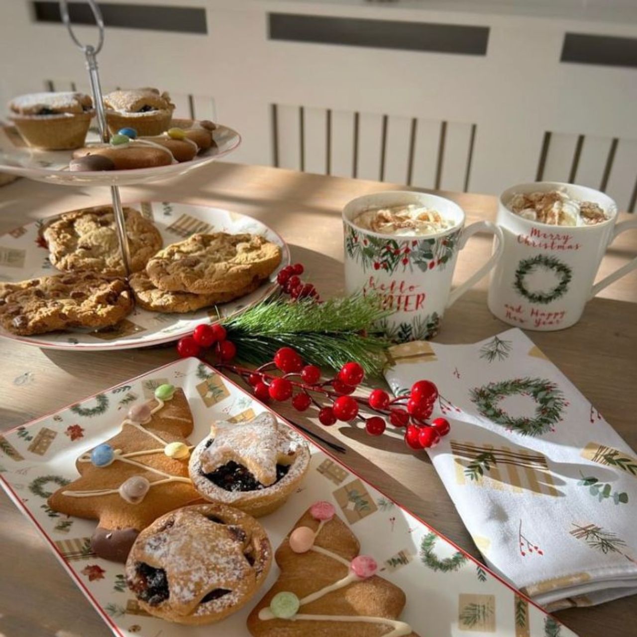 Christmas Spirit Two Tier Cake Stand by Mindy Brownes Introducing our enchanting Christmas spirit collection. Designed to add a touch of festive elegance to your festive gatherings. This beautiful collection is adorned with exquisite Christmas motifs such as wrapped Christmas gifts, wreaths, and winter florals.