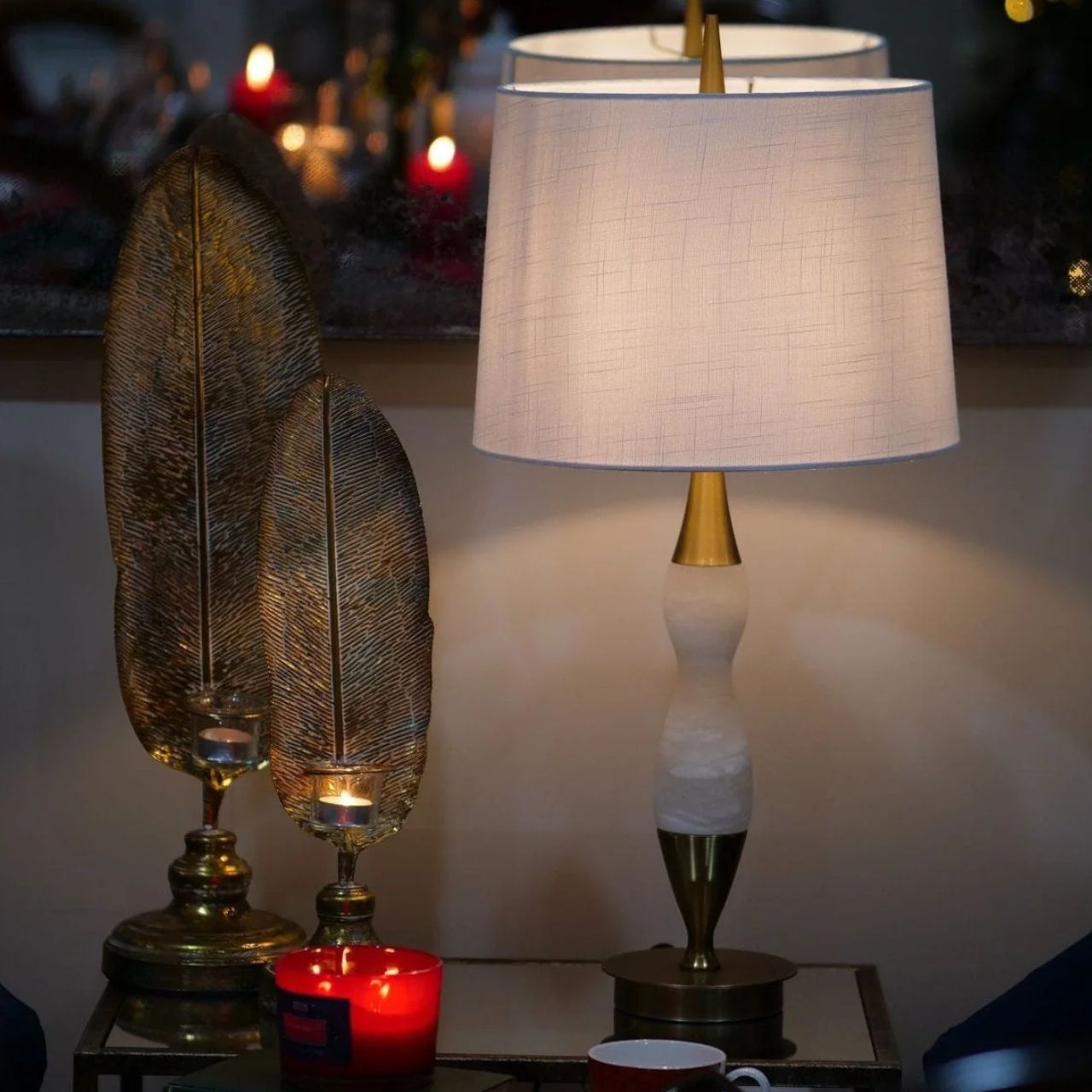 This lamp features white marble, brass accents, and a curved design. Ideal for those of you looking to add some softness to your home.