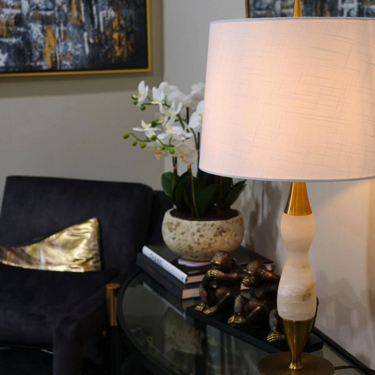 This lamp features white marble, brass accents, and a curved design. Ideal for those of you looking to add some softness to your home.