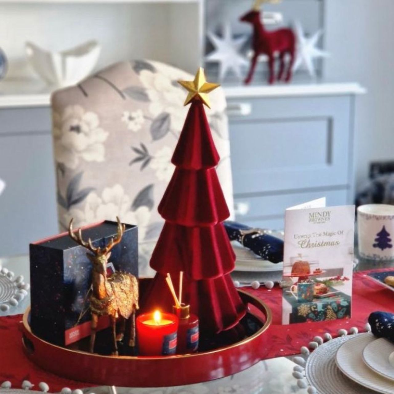 Festive Night Tray by Mindy Brownes  A stunning circular tray, with a deep red surround, gold rim, and an evening Christmas floral design finished in deep lavender, with pops of red. An ideal styling accessory this Christmas season.